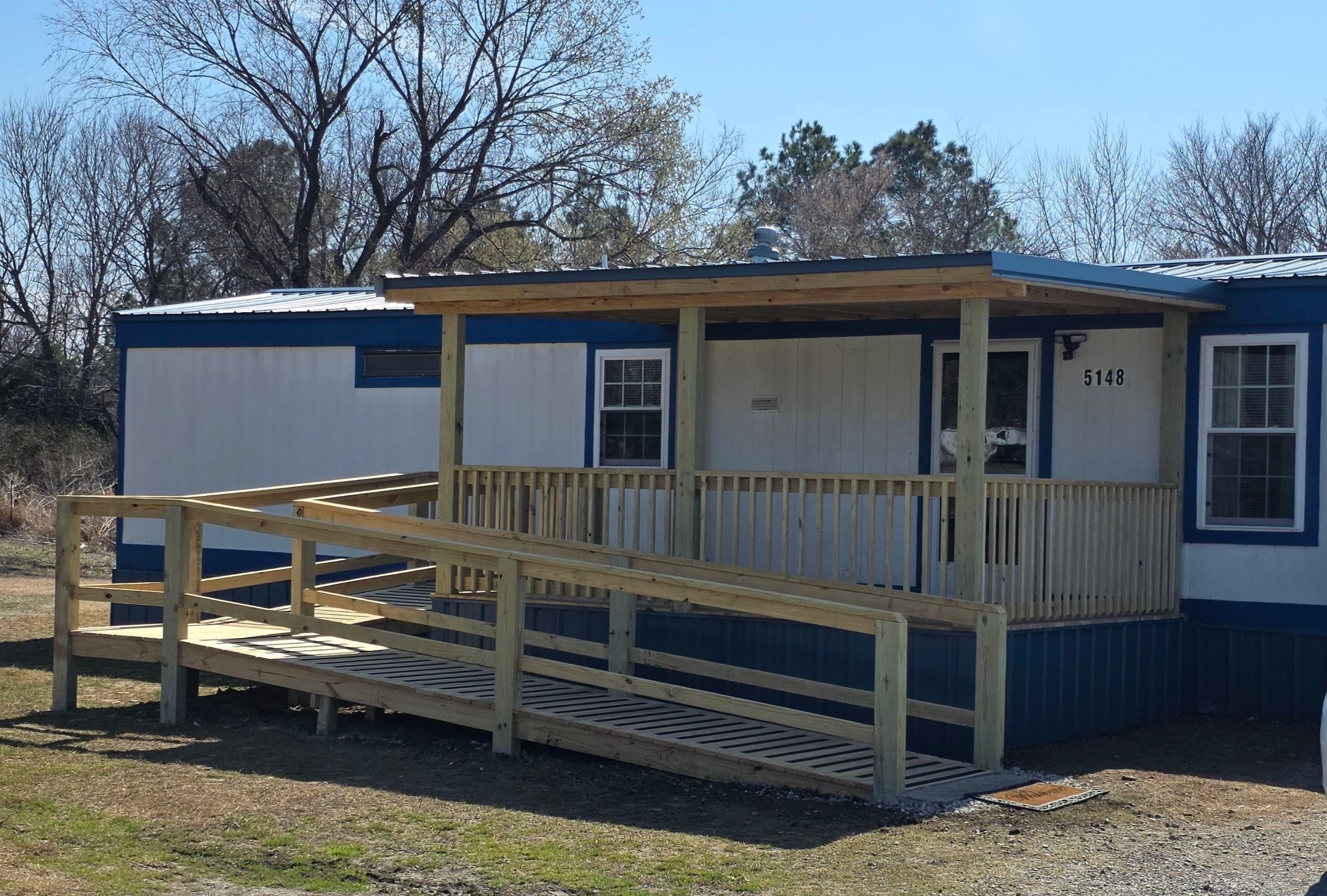 Covered Deck w/ ADA Ramp by In & Out Construction & Remodeling, LLC