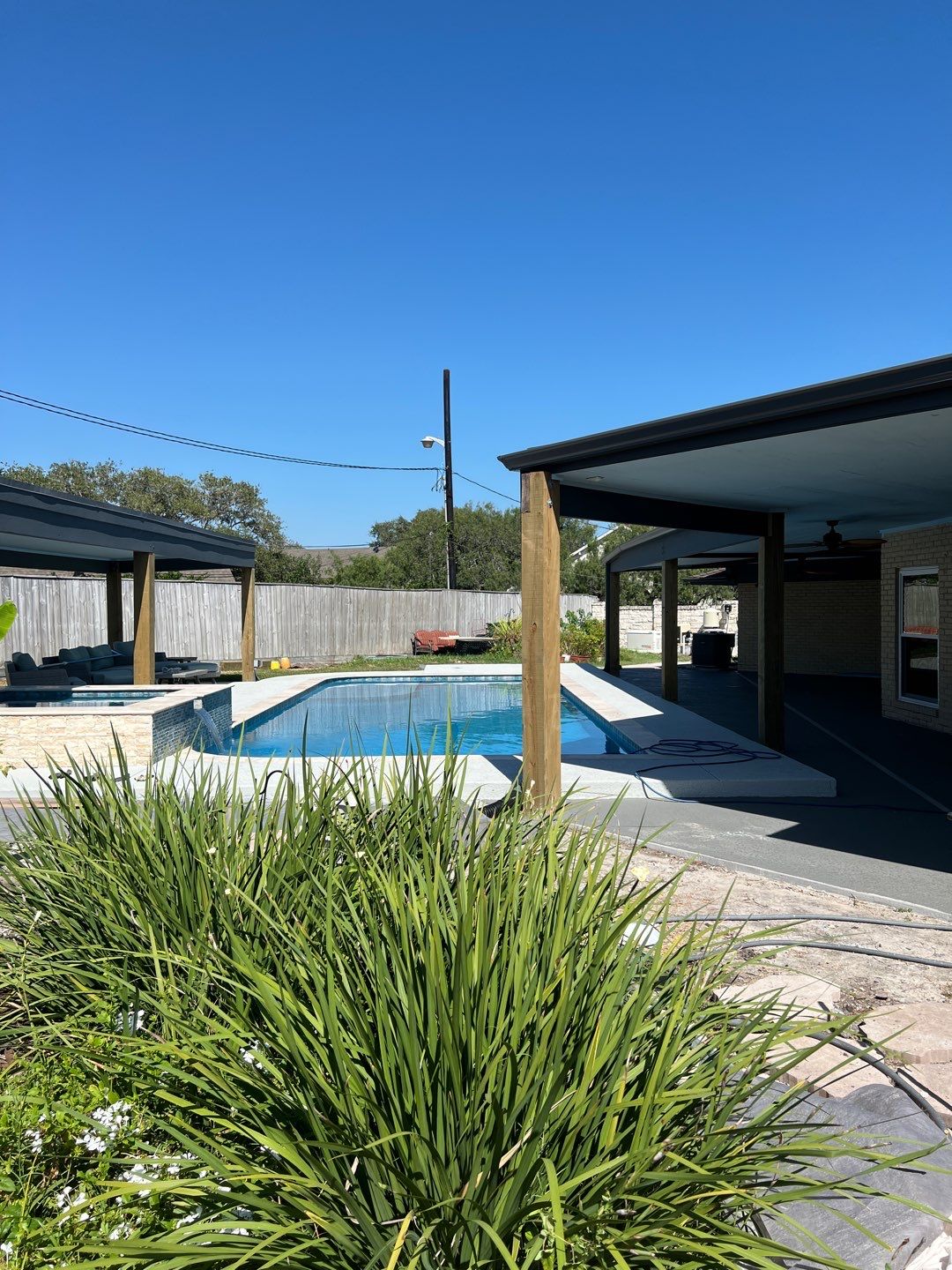 Beautiful pool side build by Bayfront Roofing and Construction