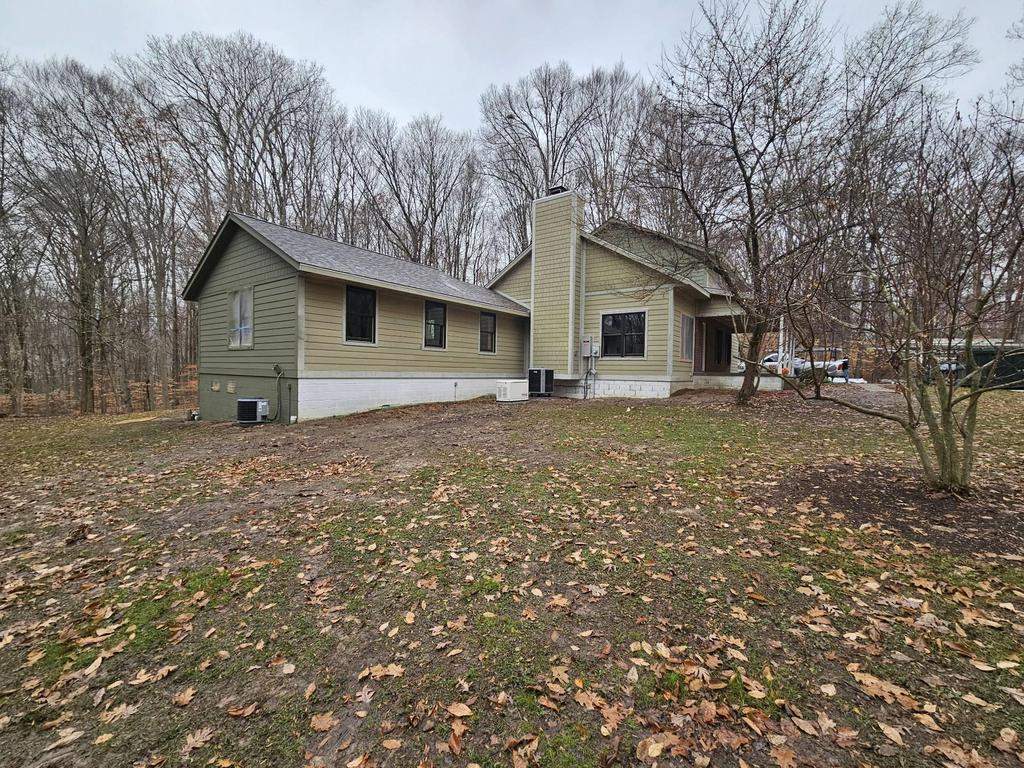 Siding Installation using Primed James Hardie & Straight Edge Shakes by Koontz Construction