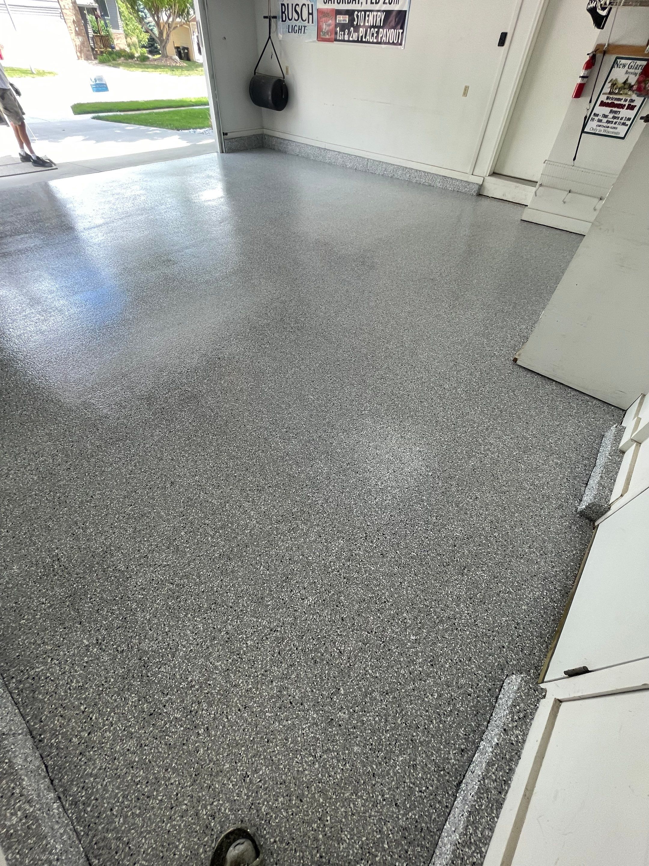 Residential Garage Floor Coating with Feather Grey Finish in Sioux Falls by Select Painting, Coatings & Garage Cabinets