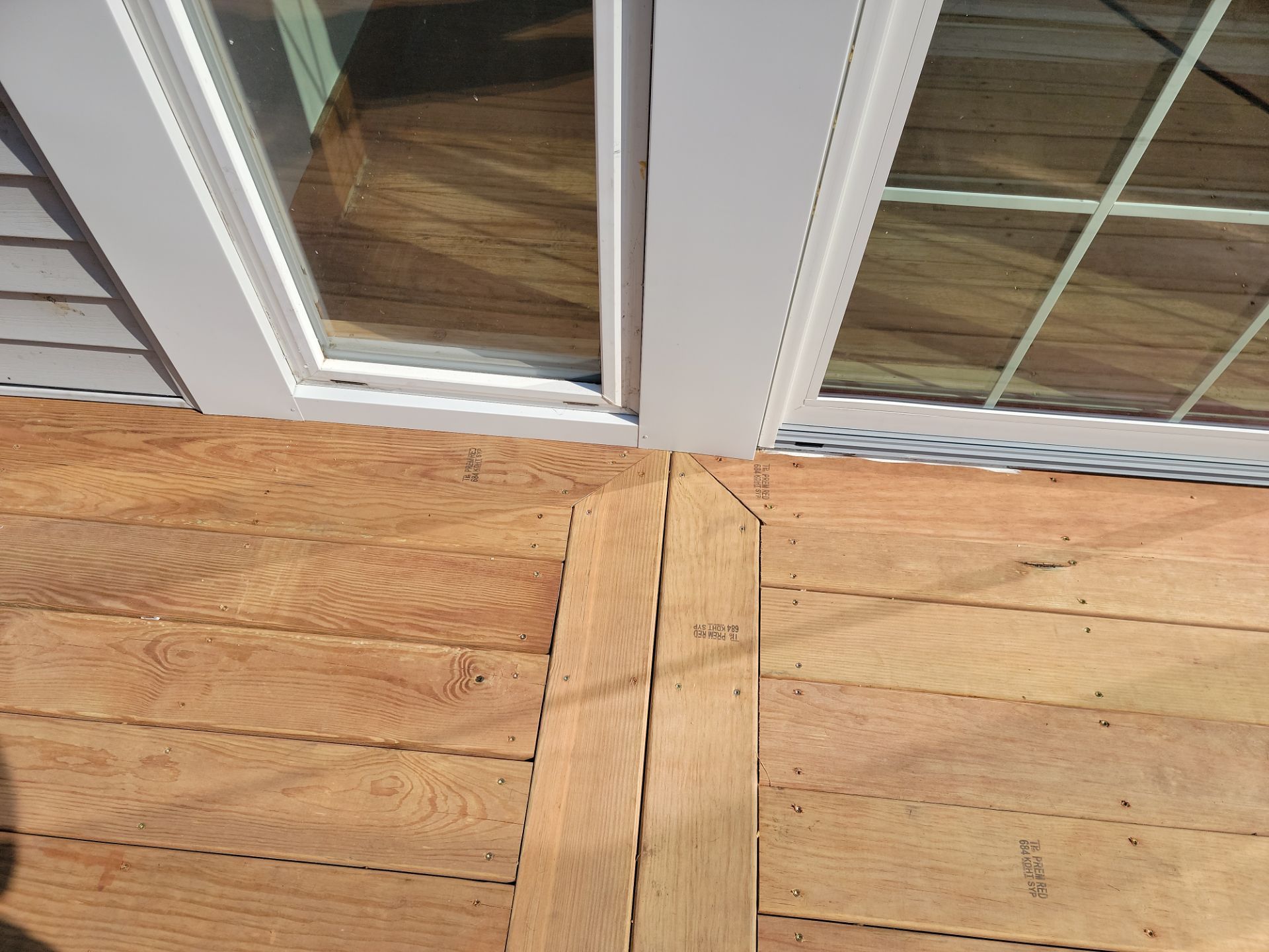 TREATED LUMBER DECK  by Avalon Roofing and Exteriors
