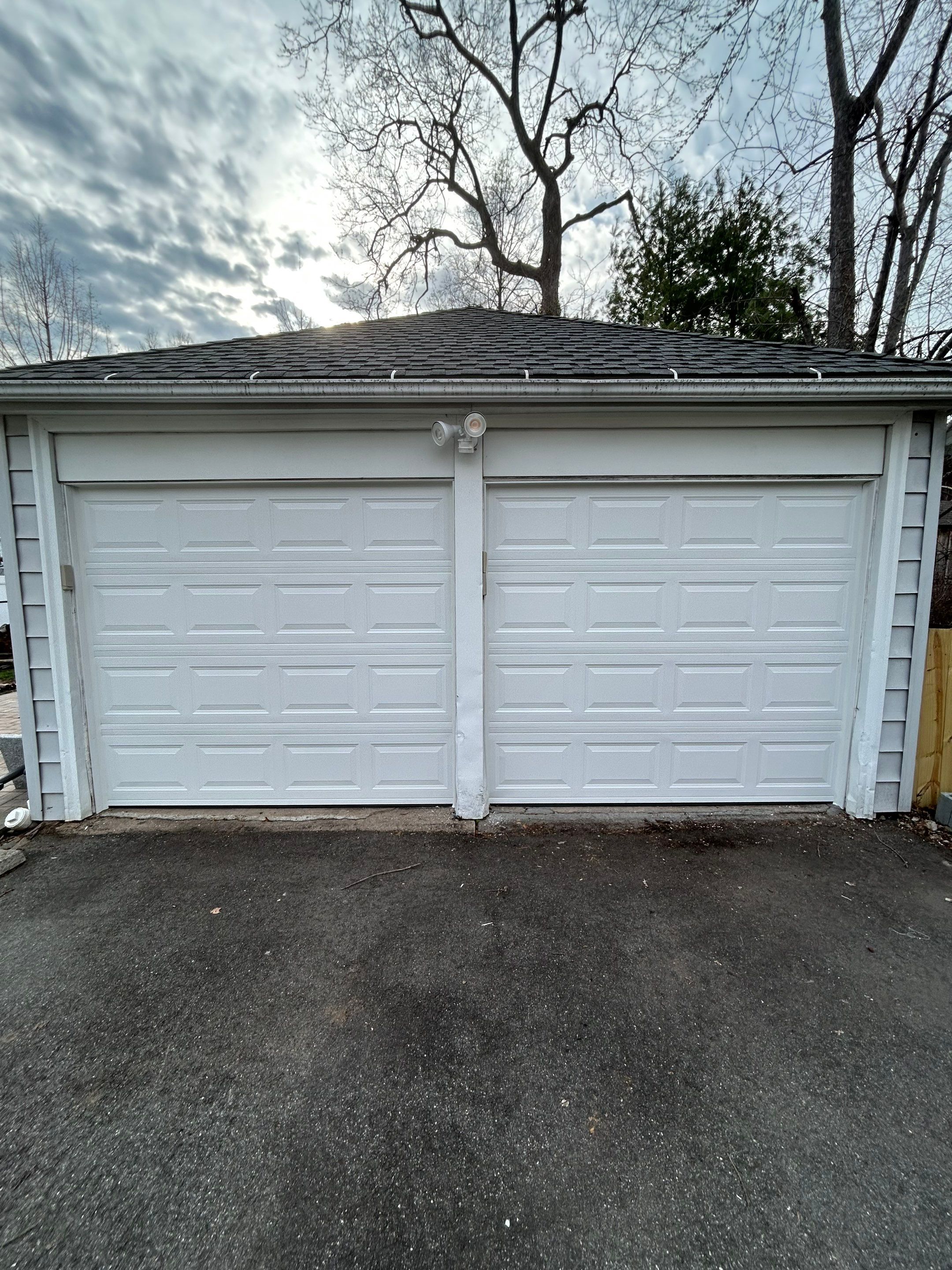 Double Garage Door Upgrade for a Clean, Unified Look by DiGiorgi Roofing and Siding Inc