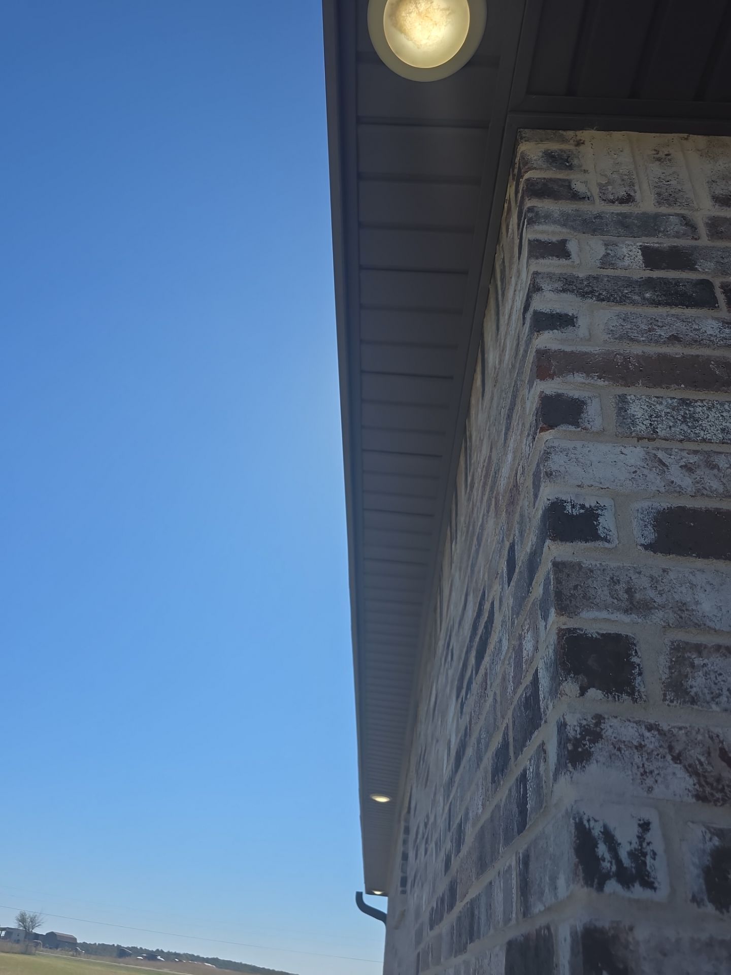 Fascia and door frames wrapped with PVC coil & soffit installation by In & Out Construction & Remodeling, LLC