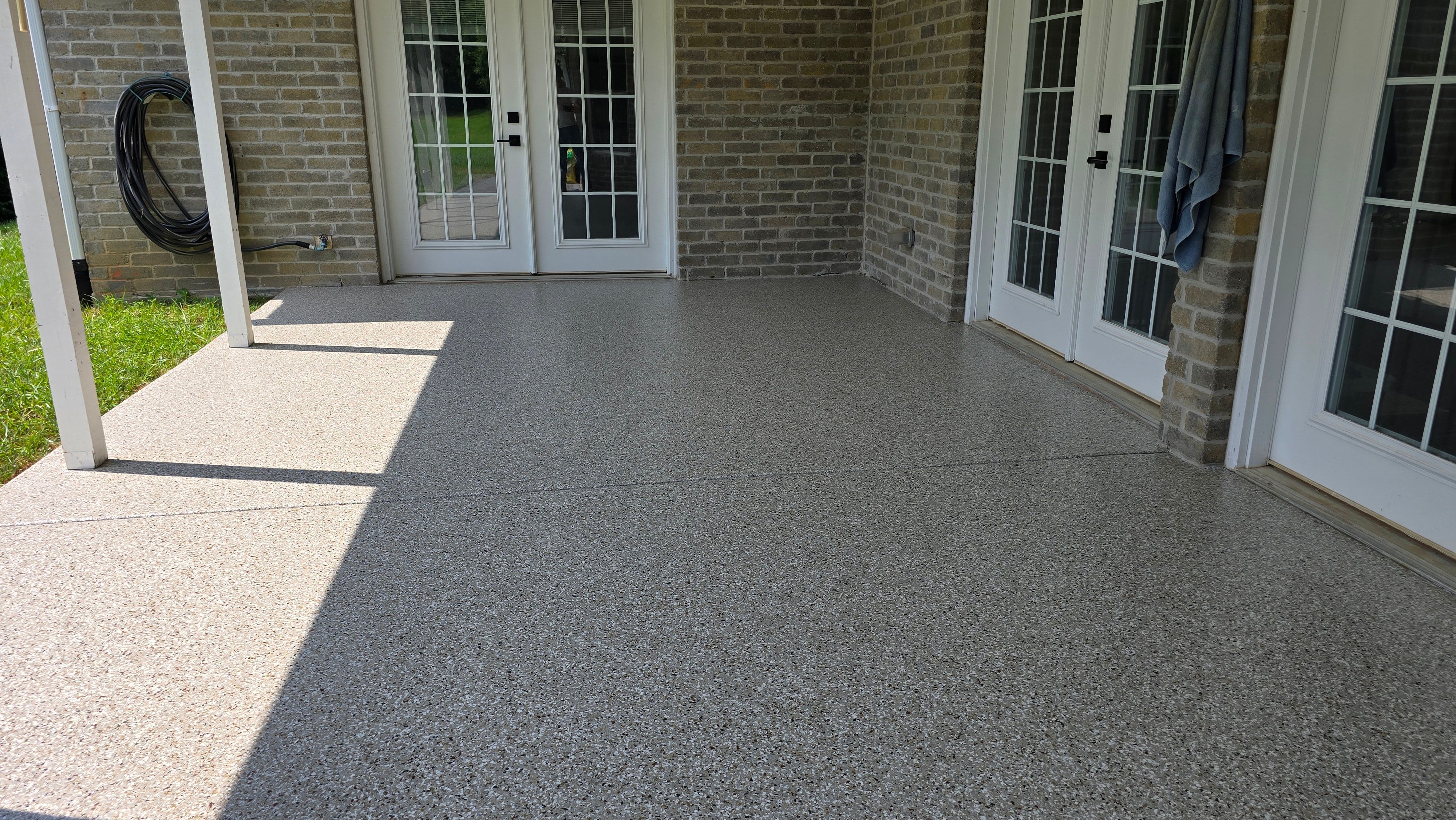 Back Patio using Creekbed by Elite Floor Solutions