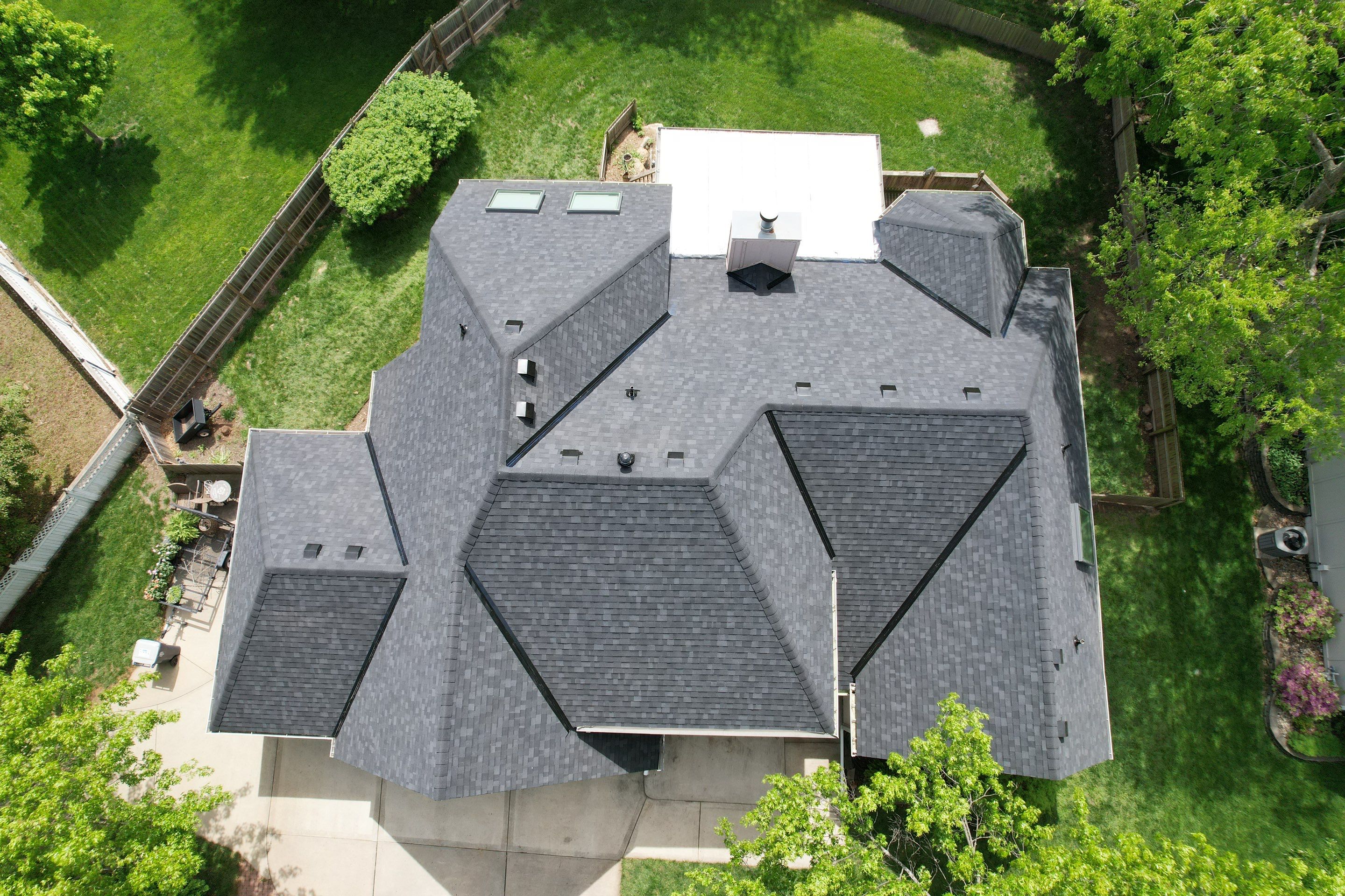 Comprehensive Roof Replacement and Skylight Installation in Kansas City by Liberty Roofing