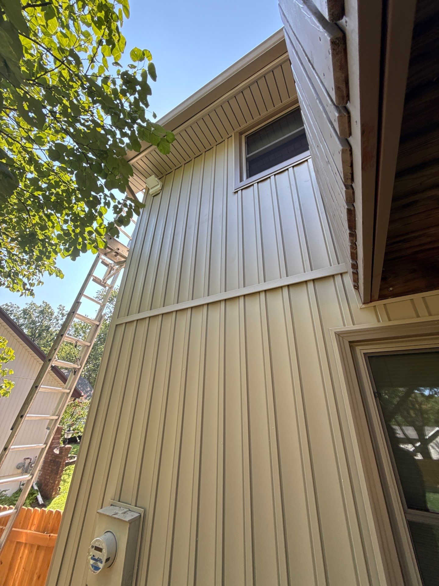 Comprehensive Kansas City Exterior Remodel Featuring Board And Batten Siding by EEC Windows, Siding & Roofing