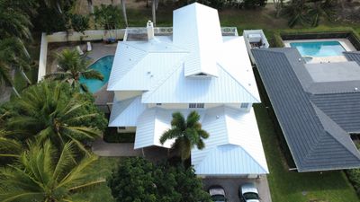 Residential Roofing Installation using 1" Nail strip metal roof