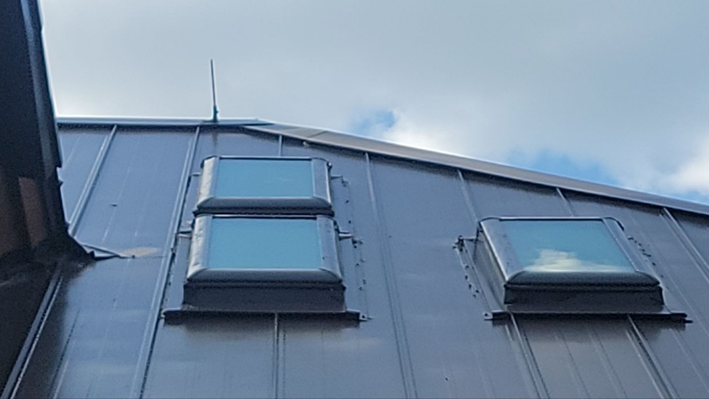Standing Seam Metal Roof Replacement After Snow Damage by ASAP Roofing & Restoration