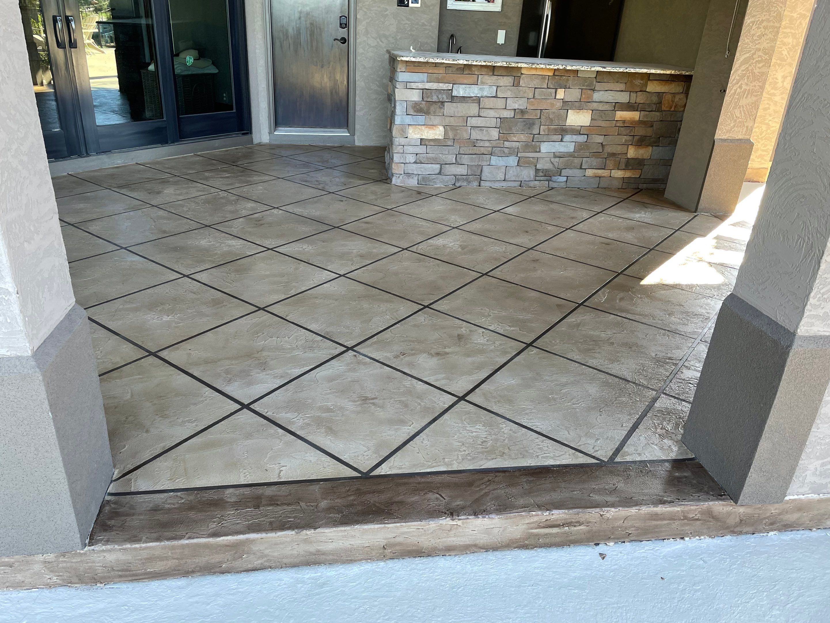 Lake Lotawana -- Front Walkway and Back Patio Tuscan Overlay by Big Red Decorative Concrete, LLC