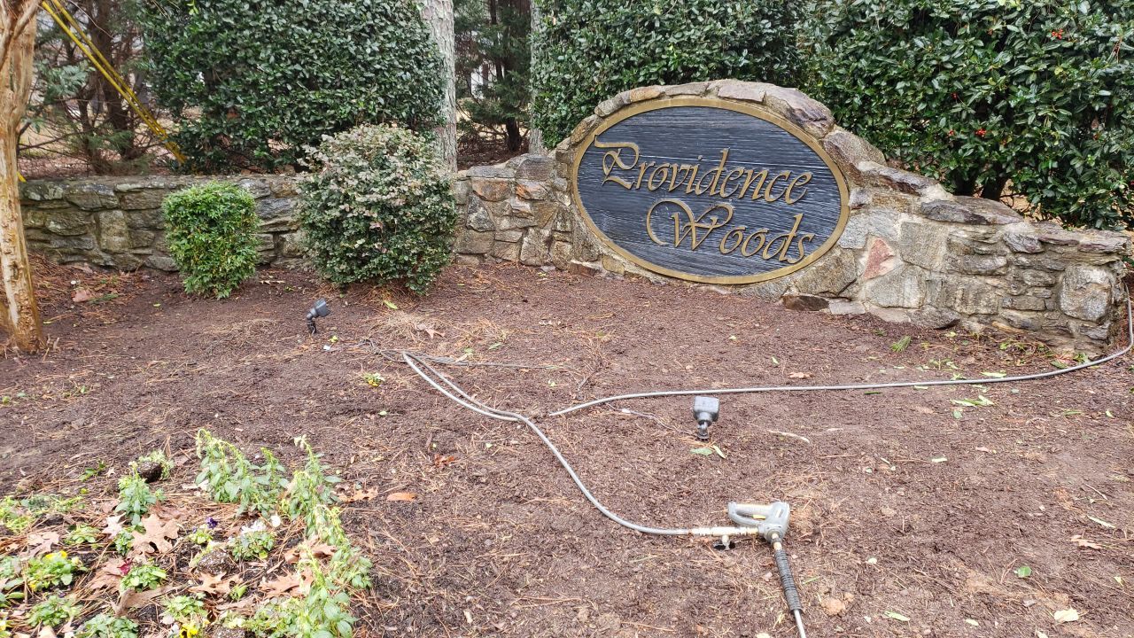 Neighberhood entrance sign cleaing using cleaner by Power Wash Masters LLC