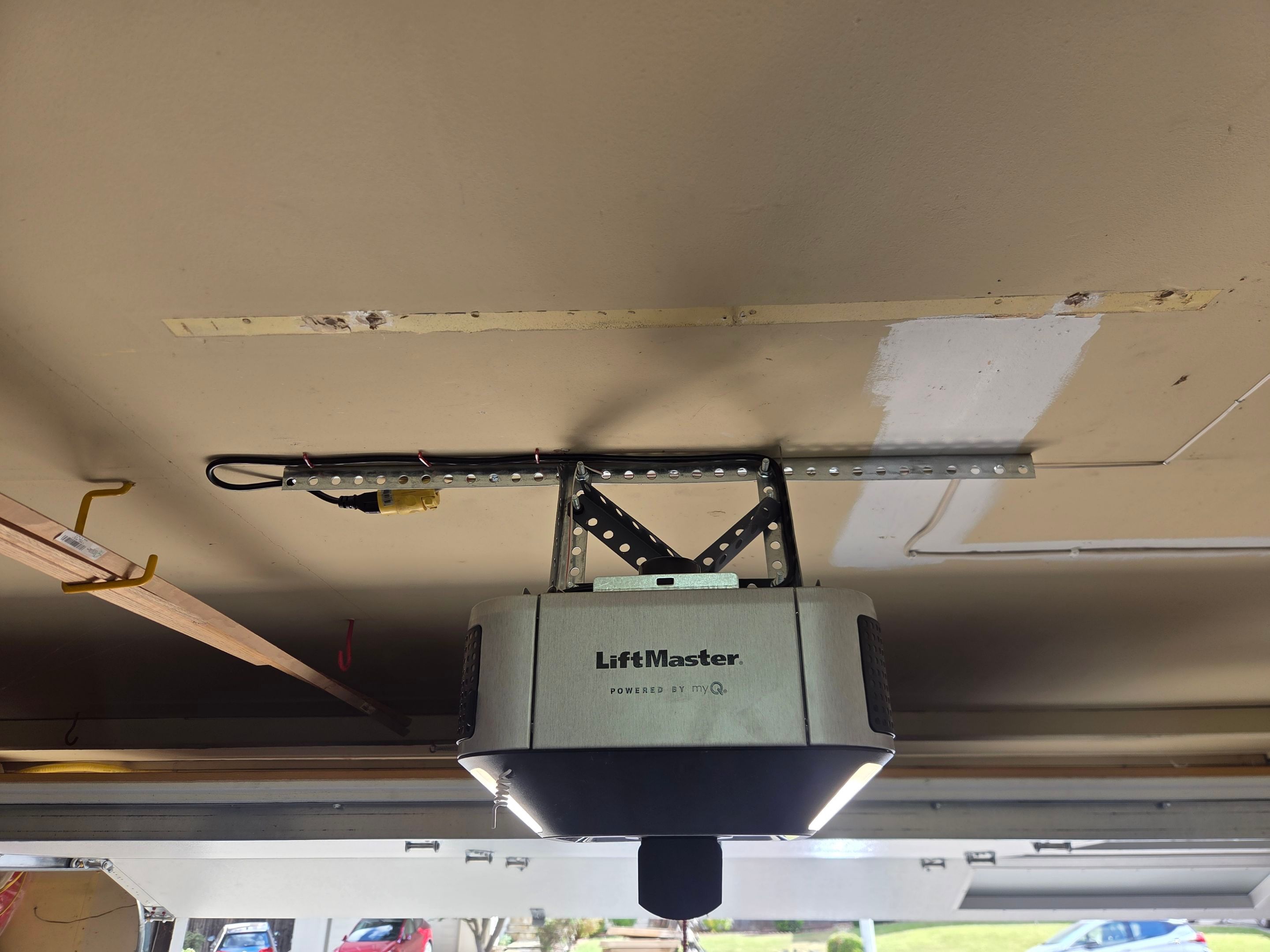 Wood-Grain Sectional Garage Door and LiftMaster Smart Opener Installation in Pleasanton by Valiant Garage Door
