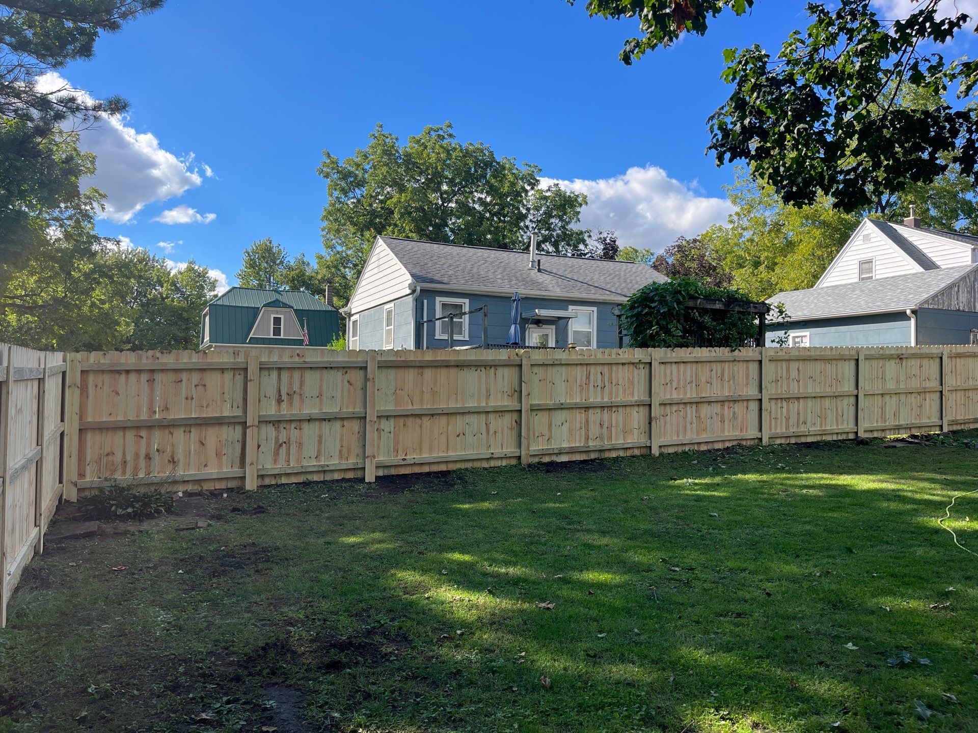 Pressure-Treated Wood Privacy Fence Installation in Waverly, Iowa by Perfect Picket Fence and Stain