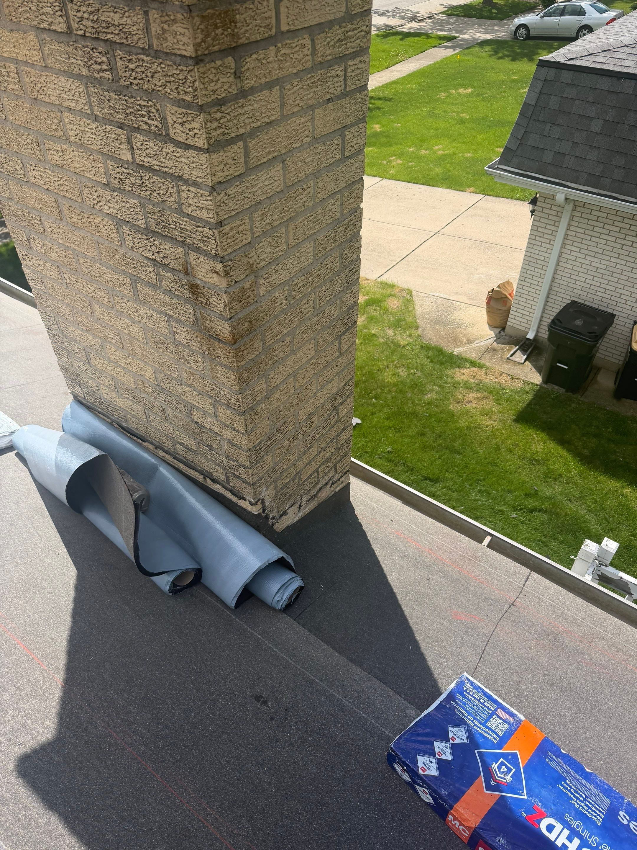 Roof replacement and chimney flashing by Optimal Home Improvement 