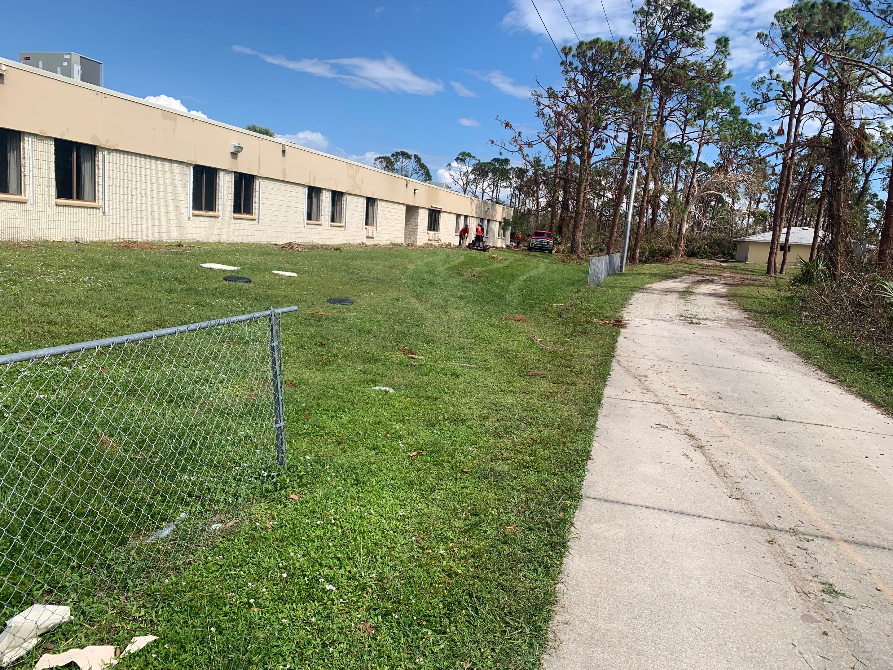 Commercial Chainlink and Vinyl Fence With Aluminum Framed Gates On Dumpster Enclosure by Asap fence and gates, LLC