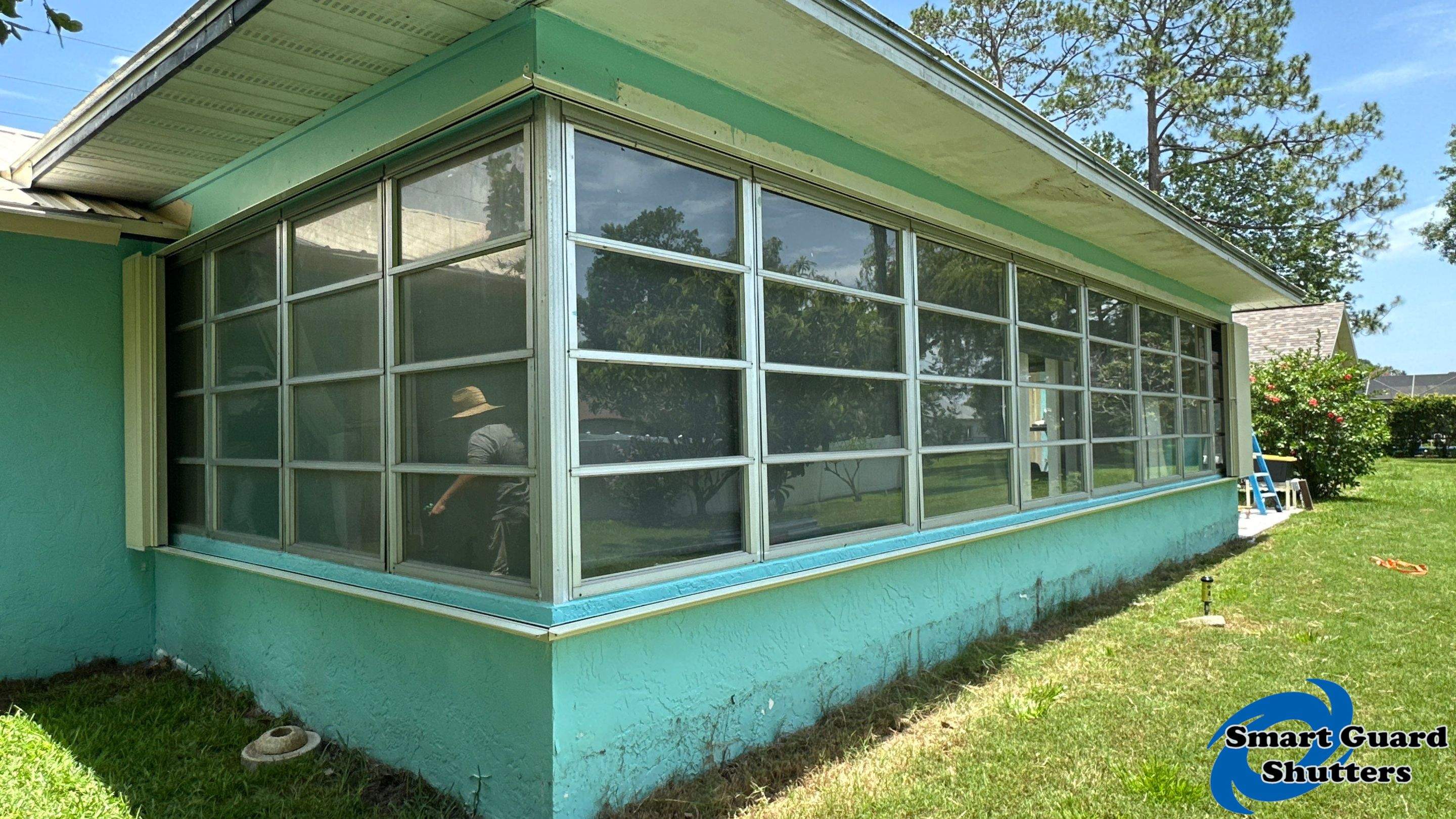 Accordion Shutter in Ivory by Smart Guard Shutters