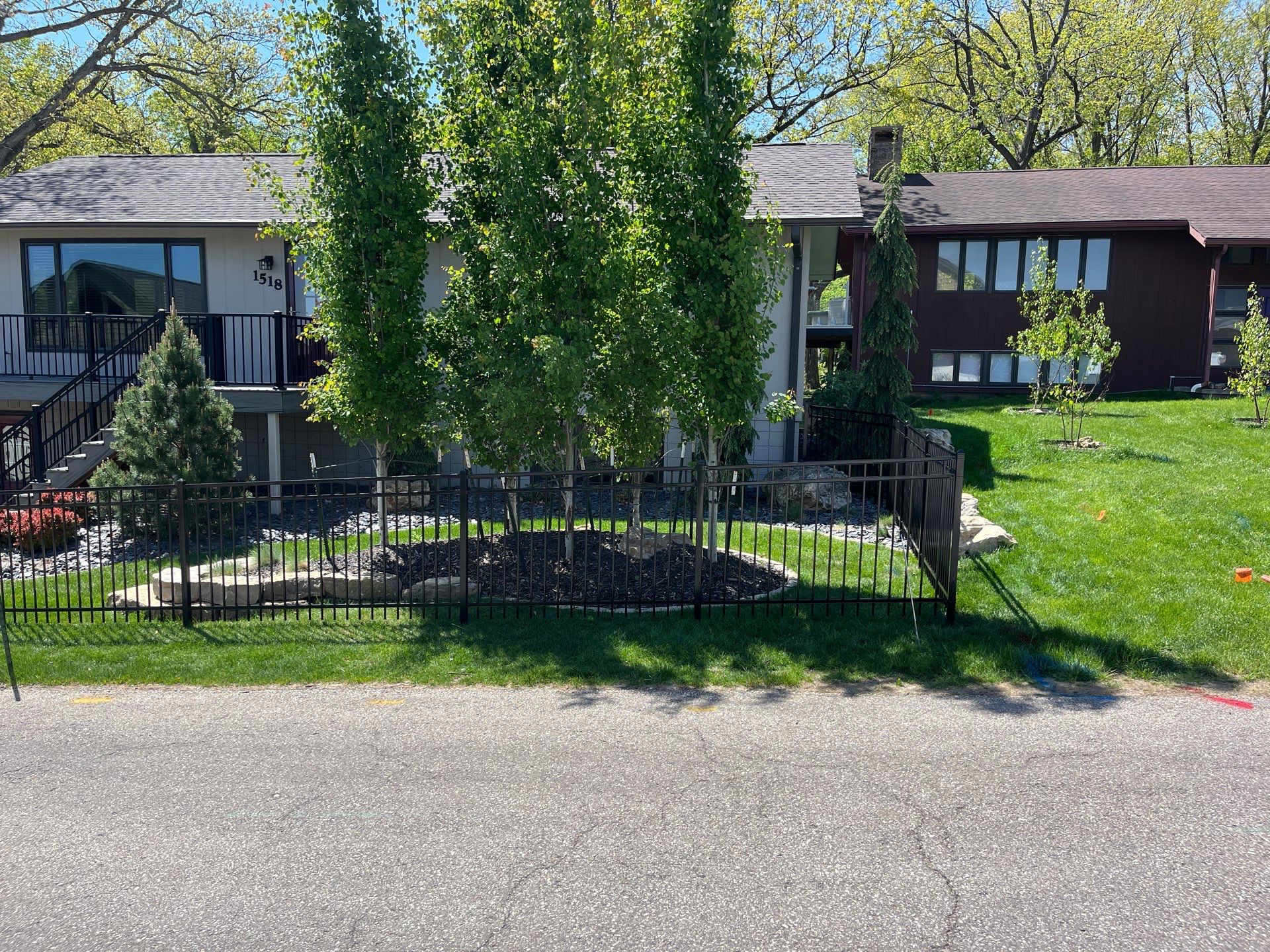 Ornamental Black Metal Picket Fence Installation in Cedar Falls by Perfect Picket Fence and Stain