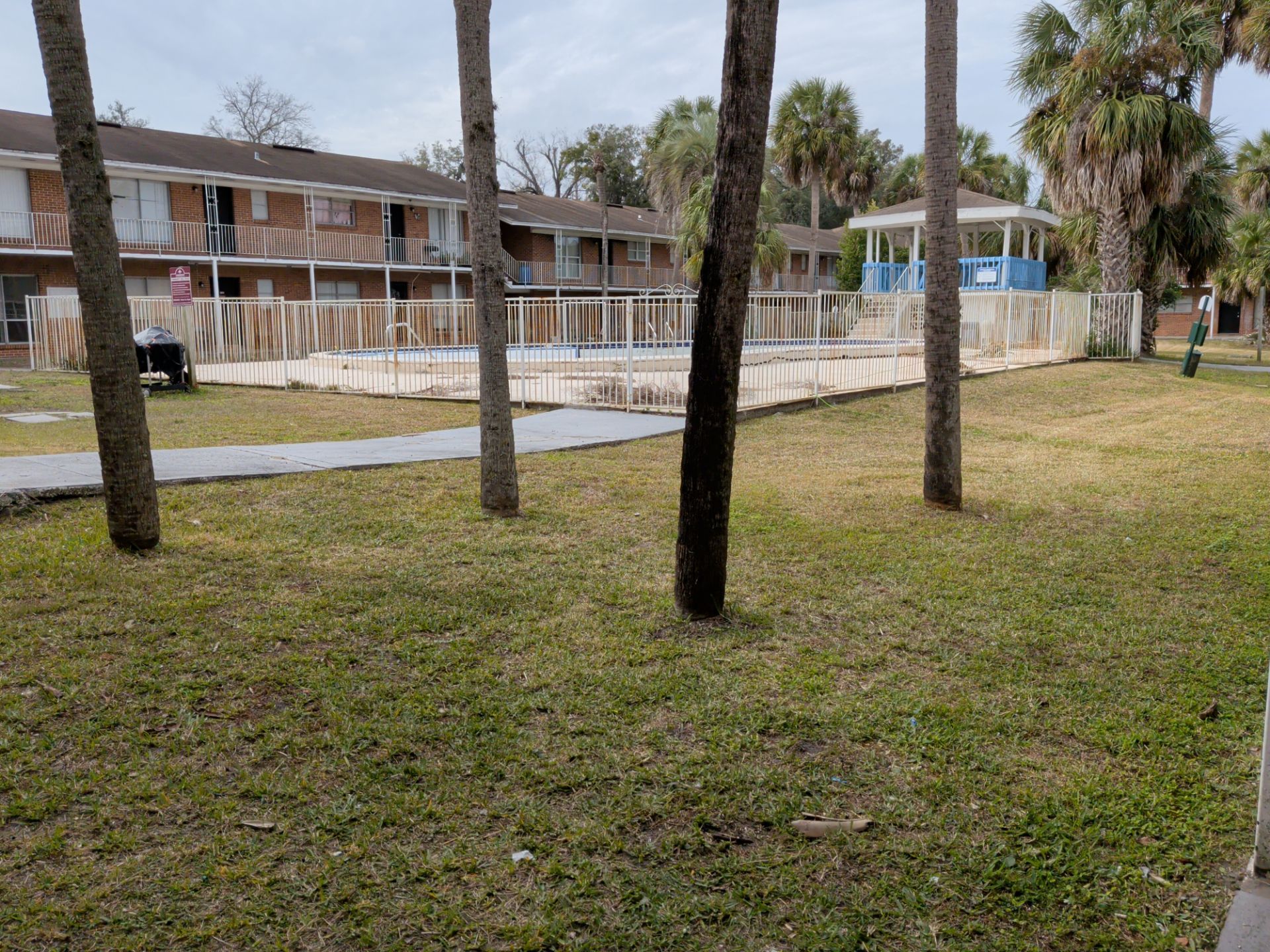Apartment Landscape Cleanup & Ongoing Grounds Maintenance — Cimarron Apartments (Arlington) by Harmoni Home Services