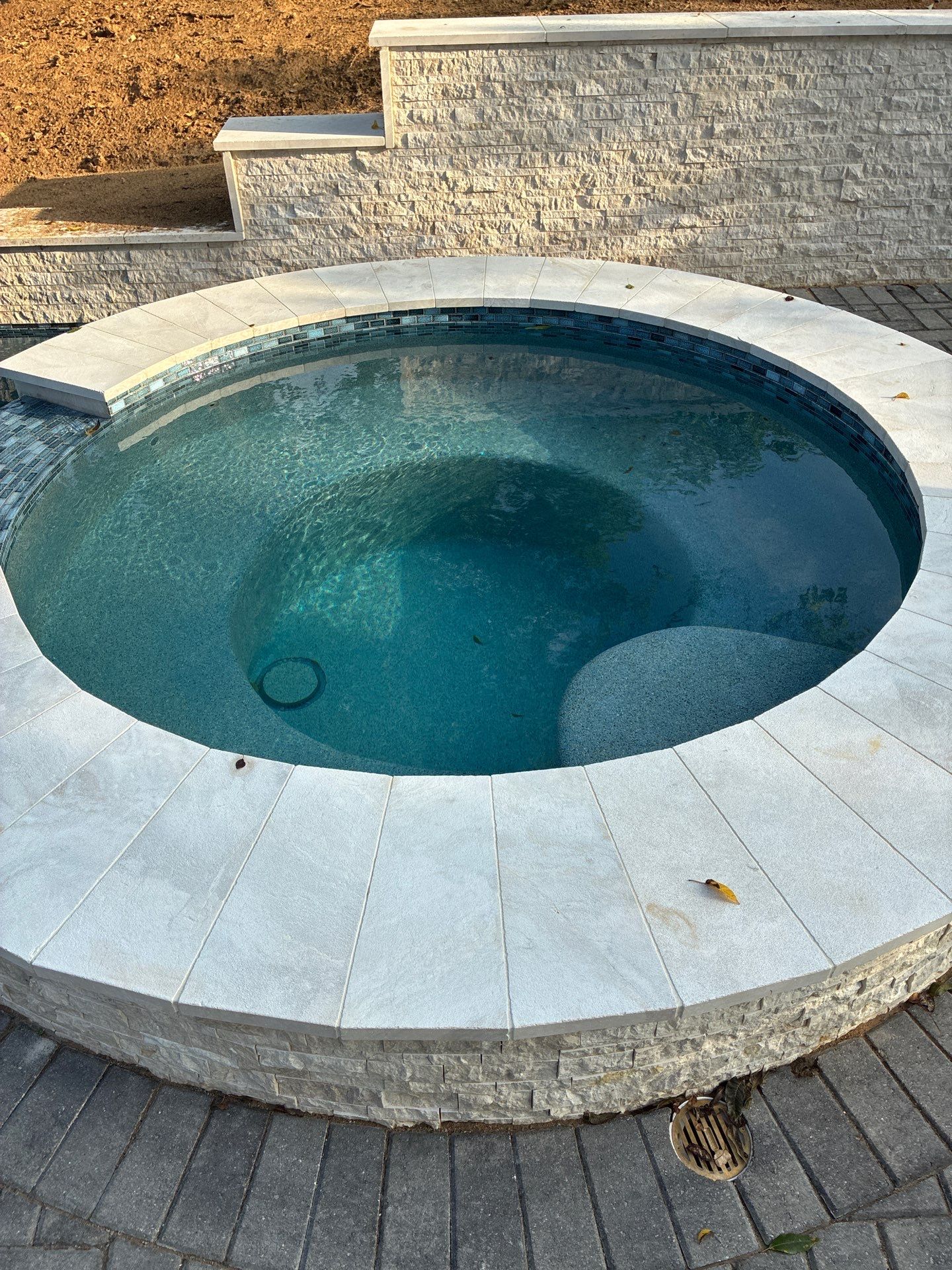 Geometric Pool with Raised Stone Spa by Pinnacle Pools and Spas - DFW