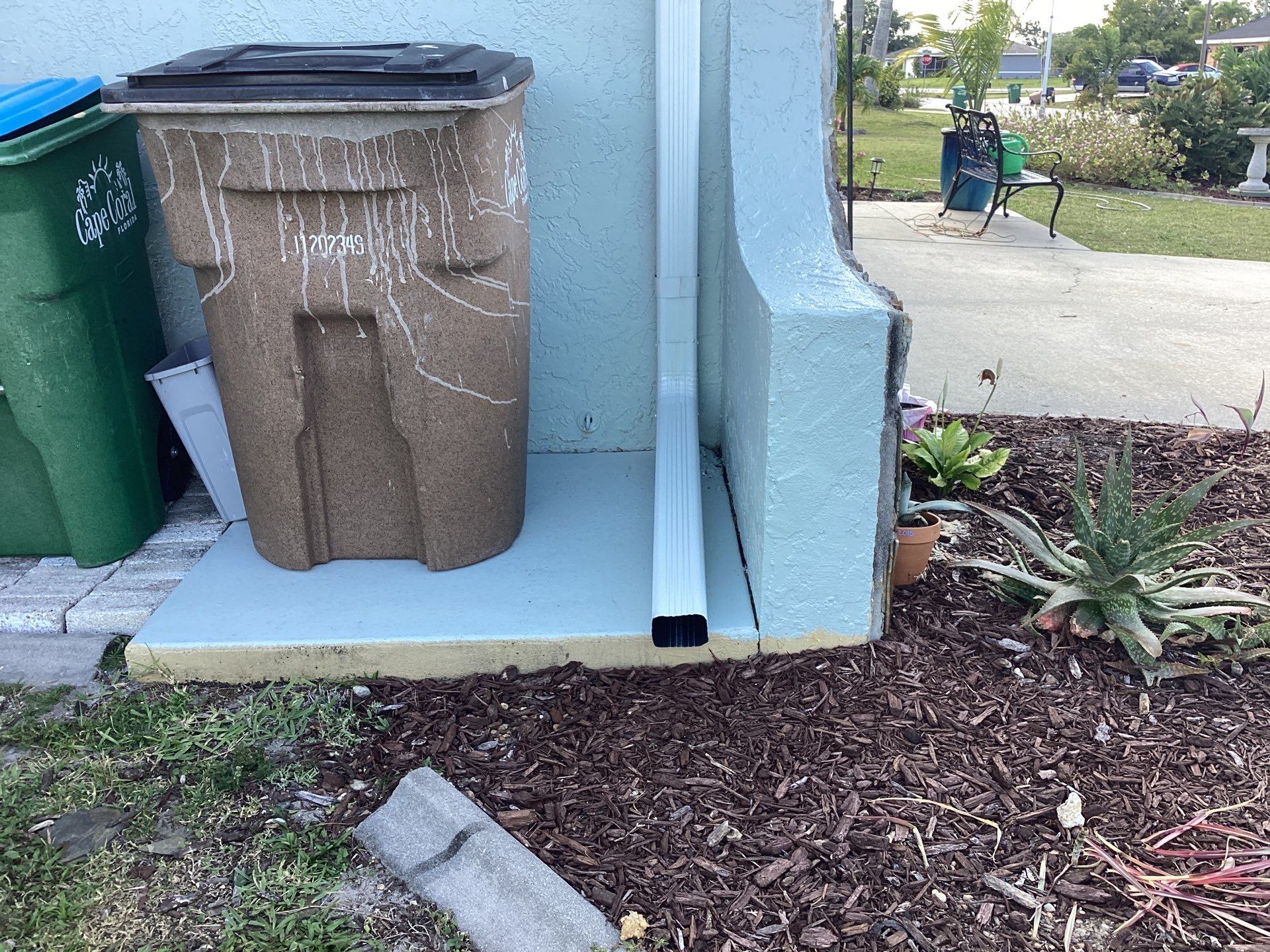 Downspout Installation using 3X4 Elbow Downspout in Cape Coral FL by Gutter Professors