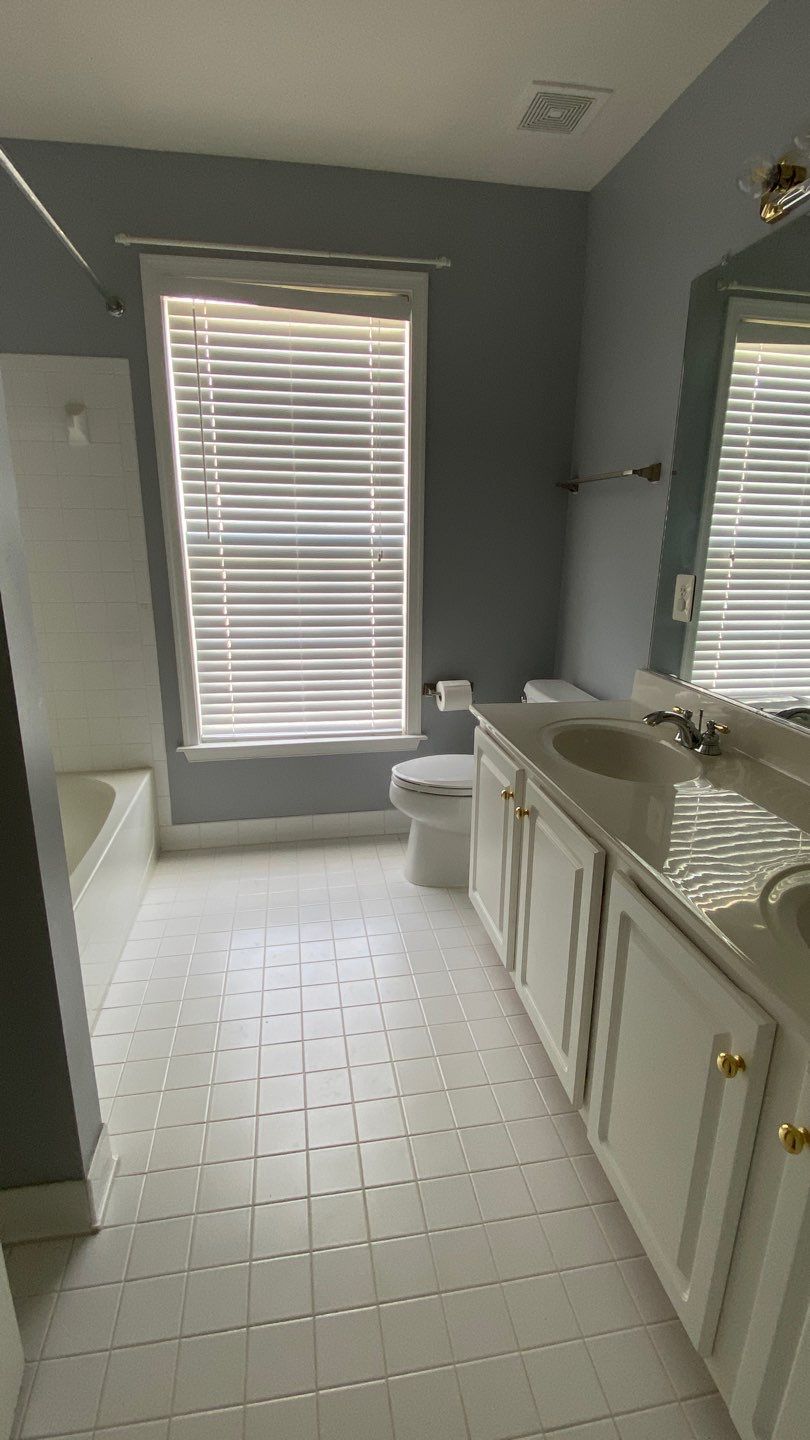 Bathroom Remodel using porcelain tiles , wood make vanetys , mirross , bathroom accessories  by Jesus Master Handyman LLC 