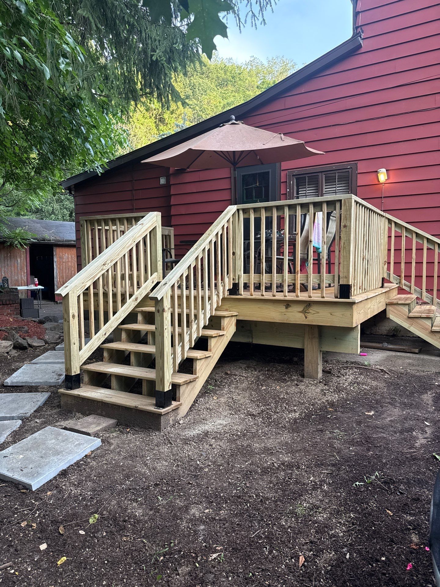 Roof sunspace deck  by Cousins Roofing Siding & Decks