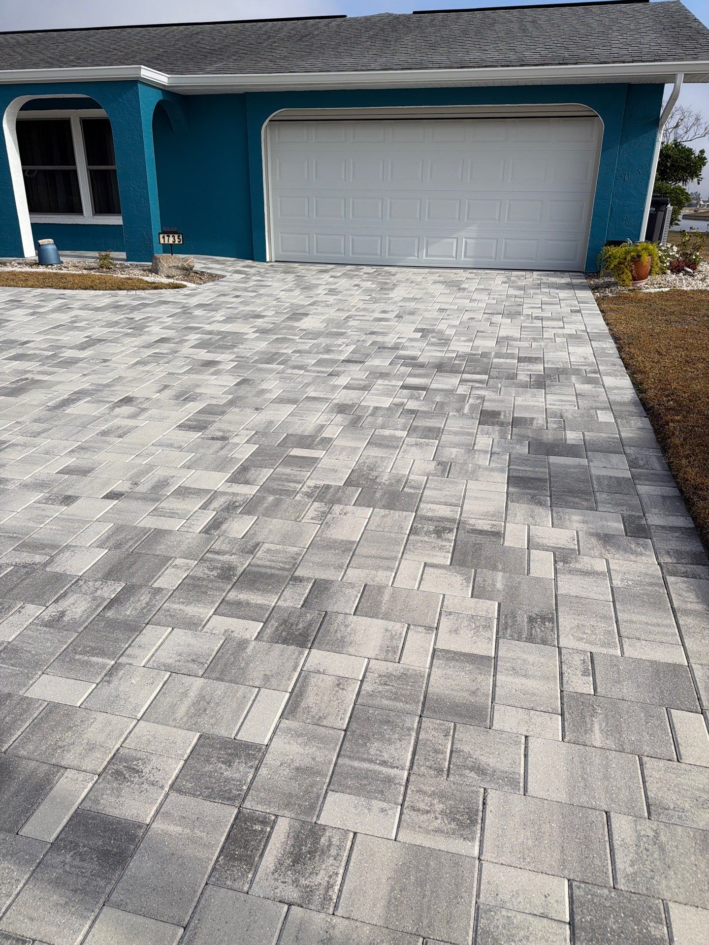 Modern Gray Paver Driveway and Entryway Walkway in Sun City Center by Supreme Paver Experts
