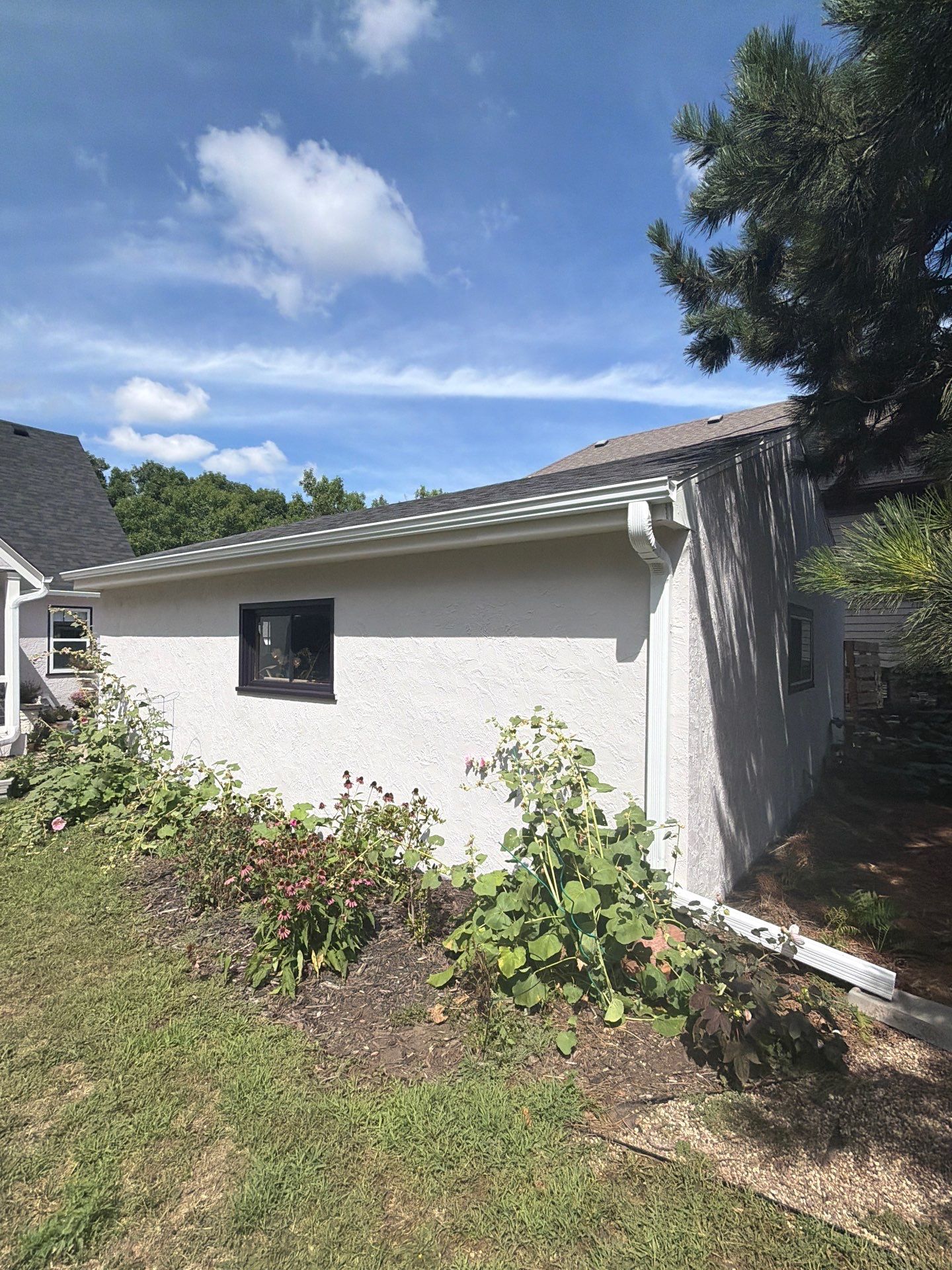 Exterior Stucco Painting and Trim Refresh in Sioux Falls by Select Painting, Coatings & Garage Cabinets