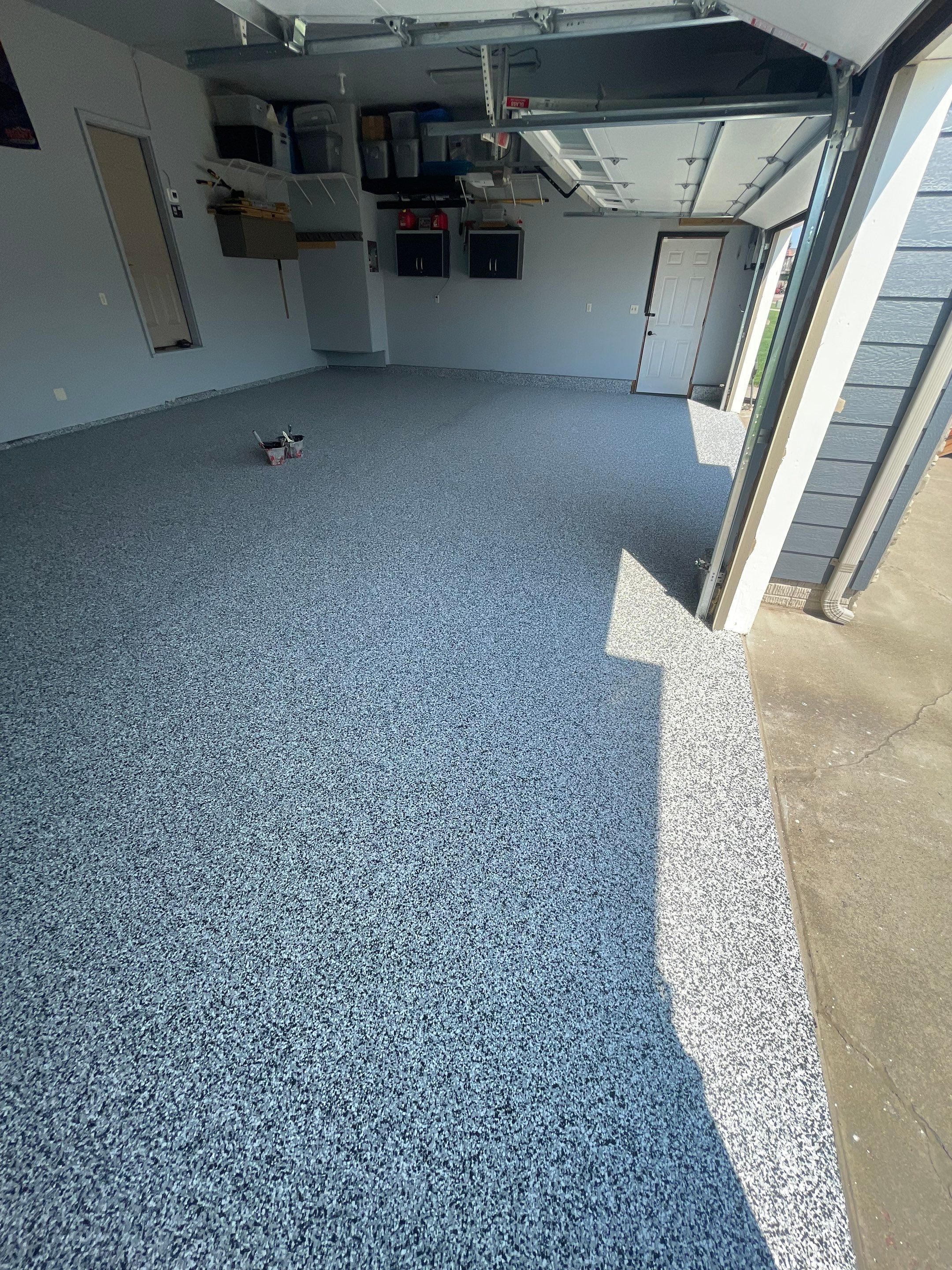Sioux Falls Garage Concrete Coating Installation with Domino Flake by Select Painting, Coatings & Garage Cabinets