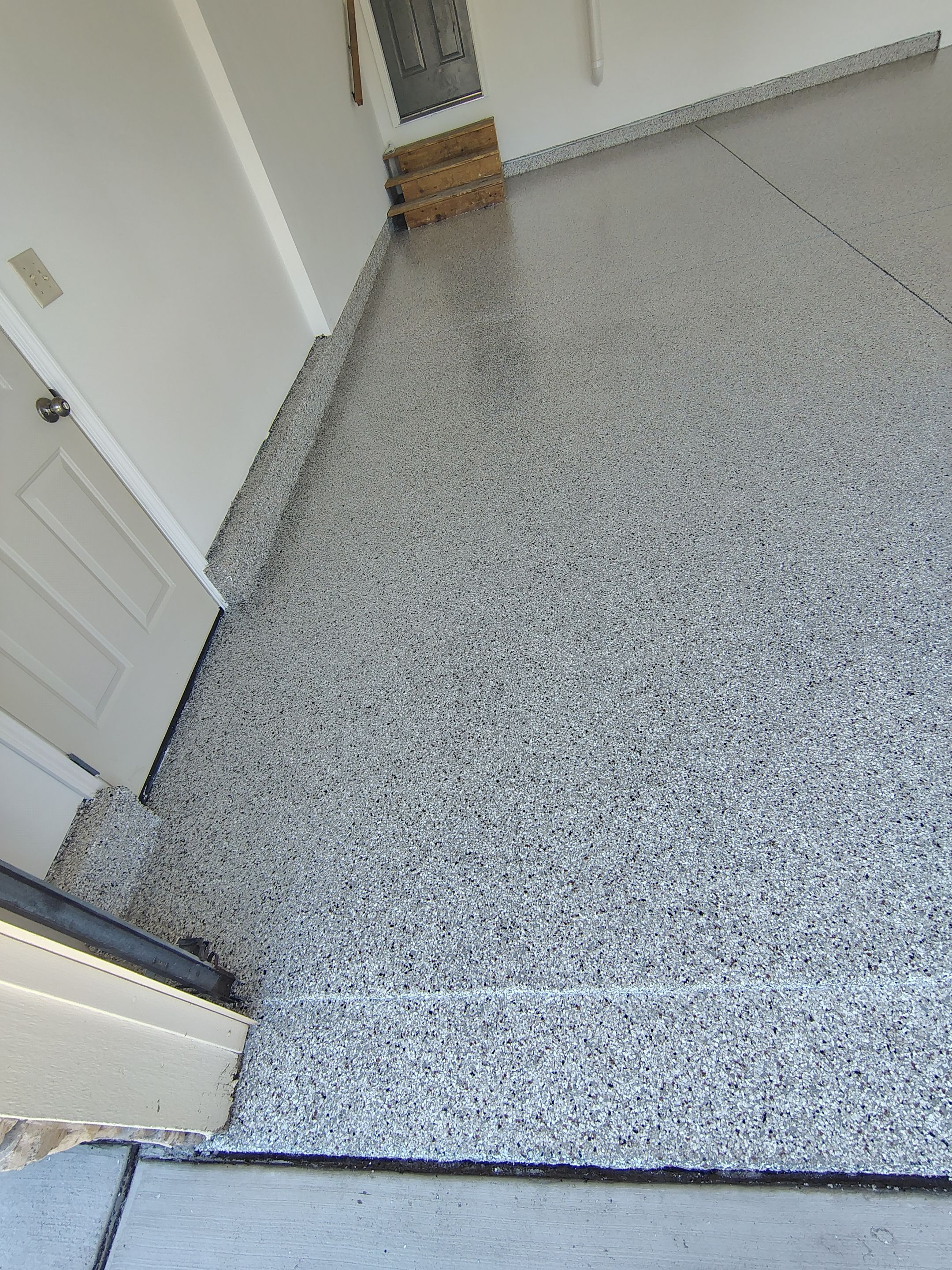 Custom Grey Speckled Epoxy Floor Coating for Sioux Falls Garage by Select Painting, Coatings & Garage Cabinets