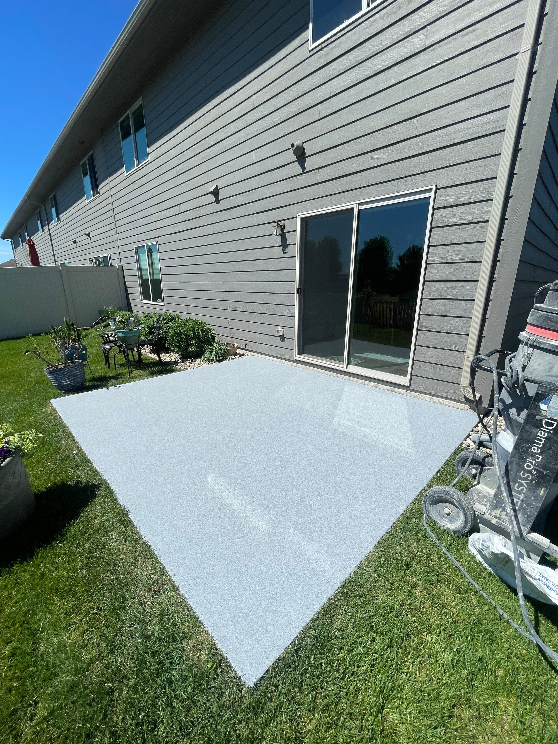 Custom Concrete Coating for Sioux Falls Patio and Front Walkway by Select Painting, Coatings & Garage Cabinets