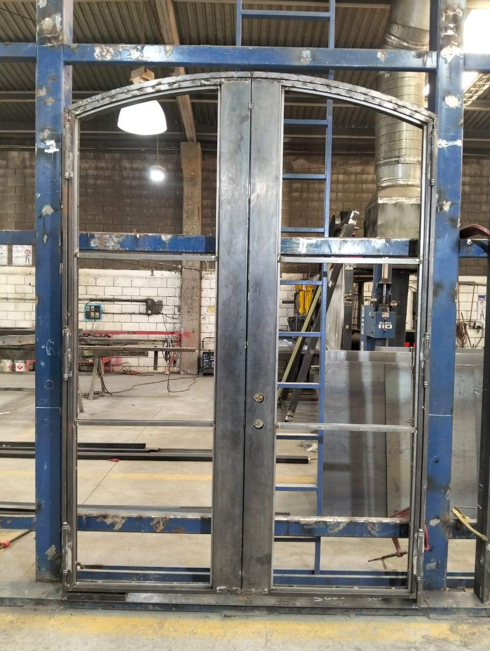 Custom Arched Entry Door Installation and Finishing in Southlake by Solara Custom Living