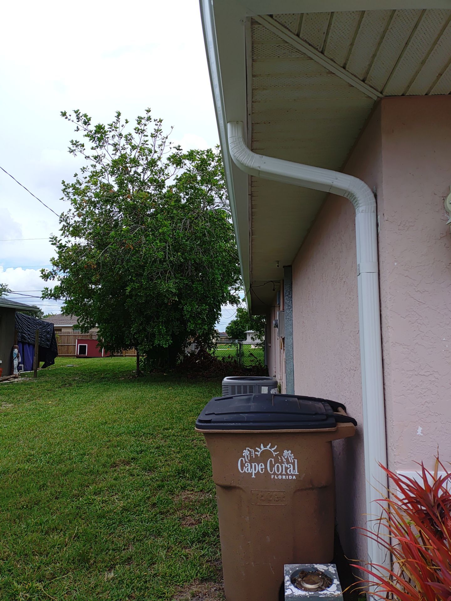Replace gutter using White Down Spouts in Cape Coral FL by Gutter Professors