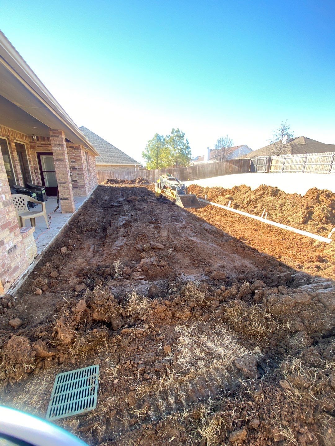 Concrete Slab , Retaining Wall , Fence, and landscape. by Clays Services Inc