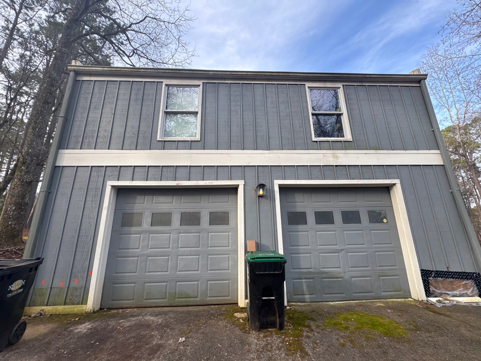 Full Exterior Transformation With Modern Black Finish by Swift Home Renovations