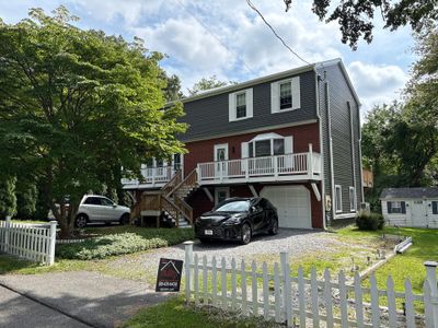 Siding Renewal Using Provia Cedar Peaks D 4.5 in Woodgrain and Tando Brick Panels