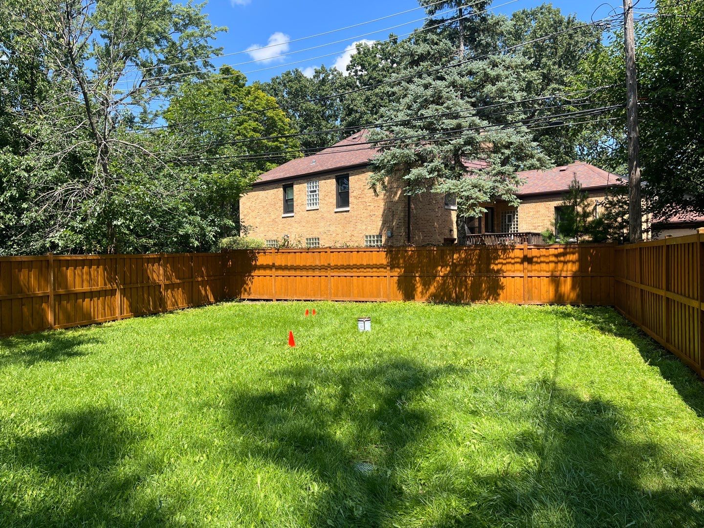 Wood fence cleaning and sealing by Northern Power Washing LLC.