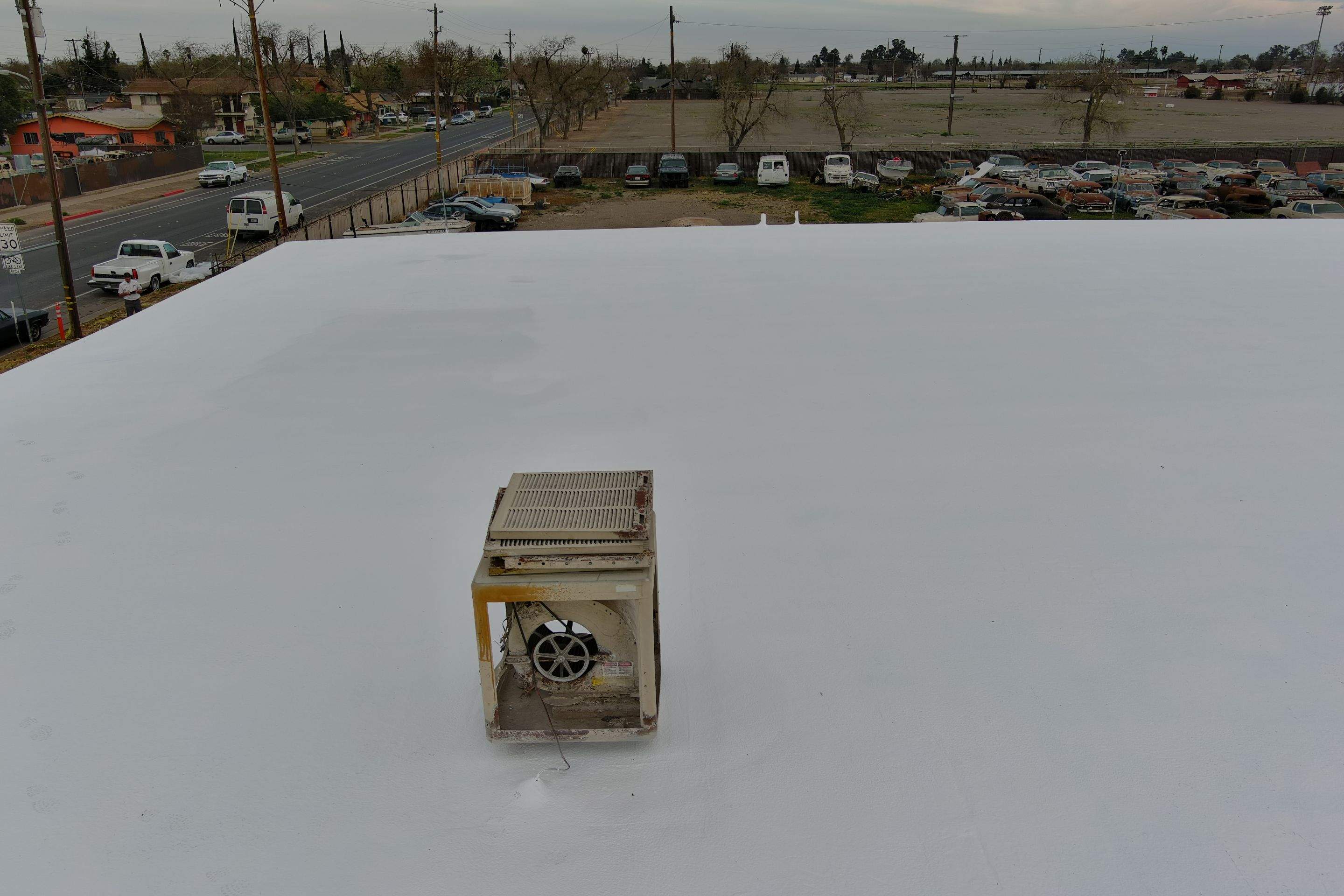 Spray foam and coatings using Conklin Benchmark/PUMA XL coatings and spray foam by Straight Edge Roofing Inc