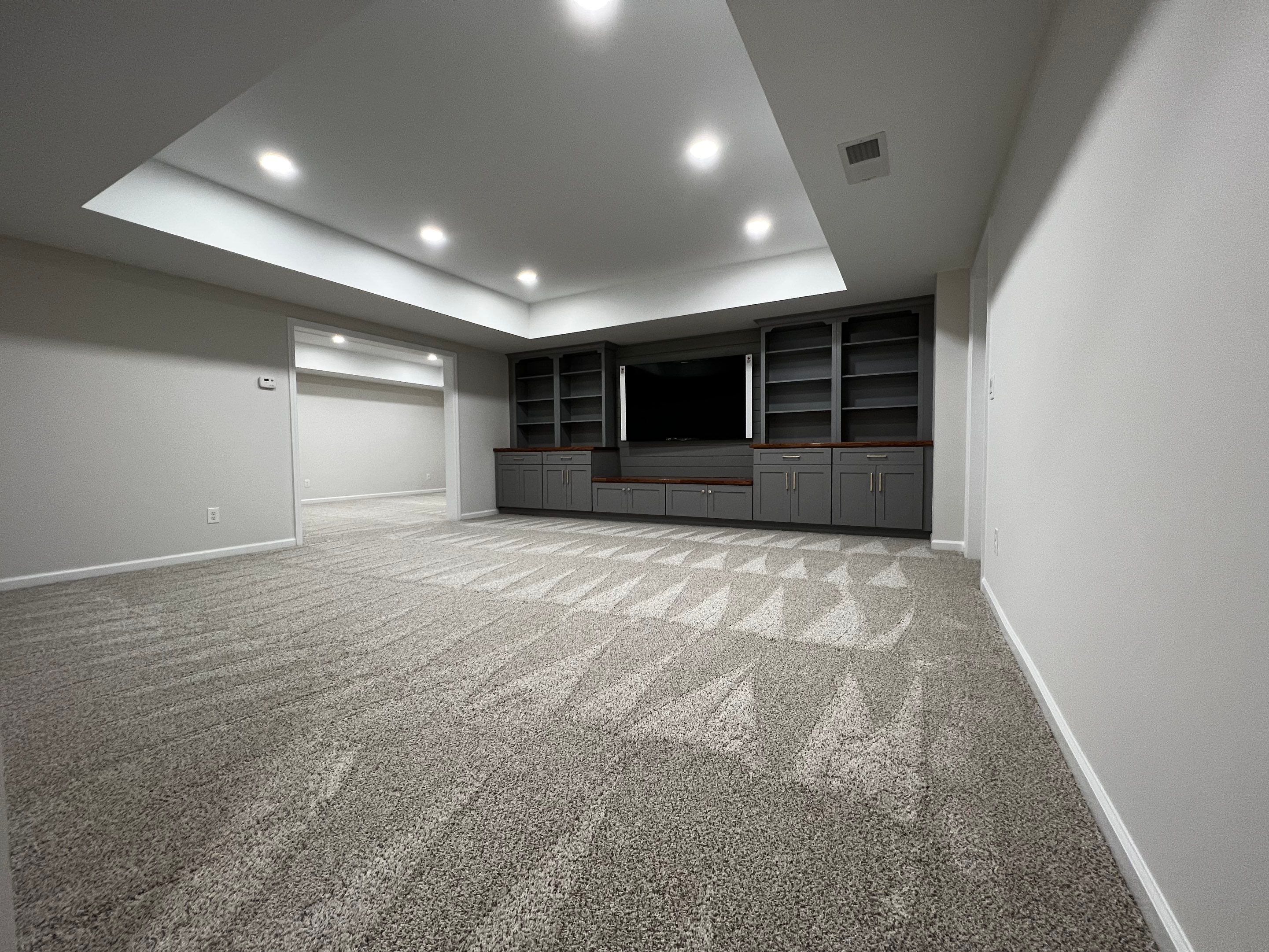 Finished Basement with Custom Built-ins and Full Bathroom in Acworth by Swift Home Renovations