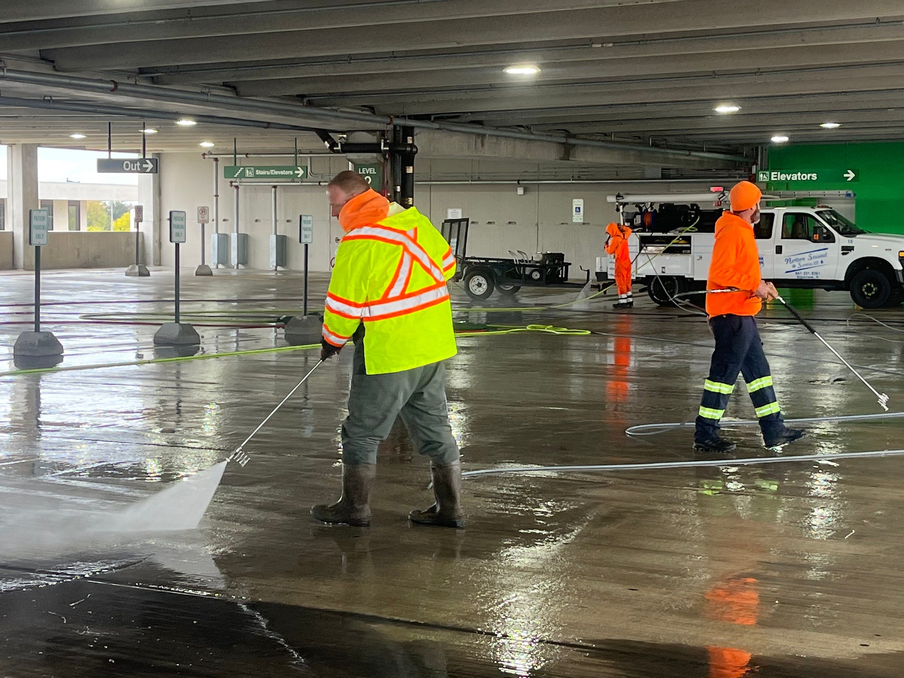 Parking garage using Hot water by Northern Power Washing LLC.