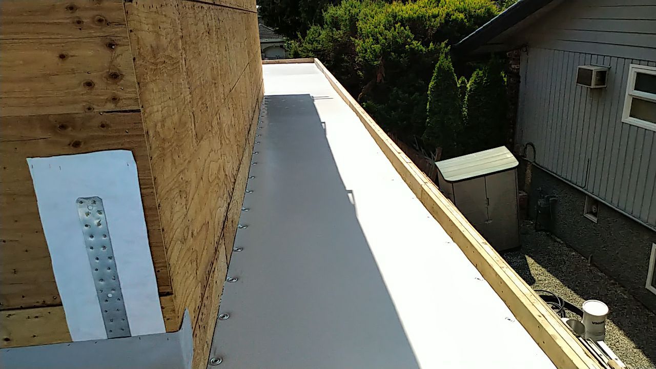 Residential Roofing Installation using Durolast roofing membrane by Top Notch Roofing Inc