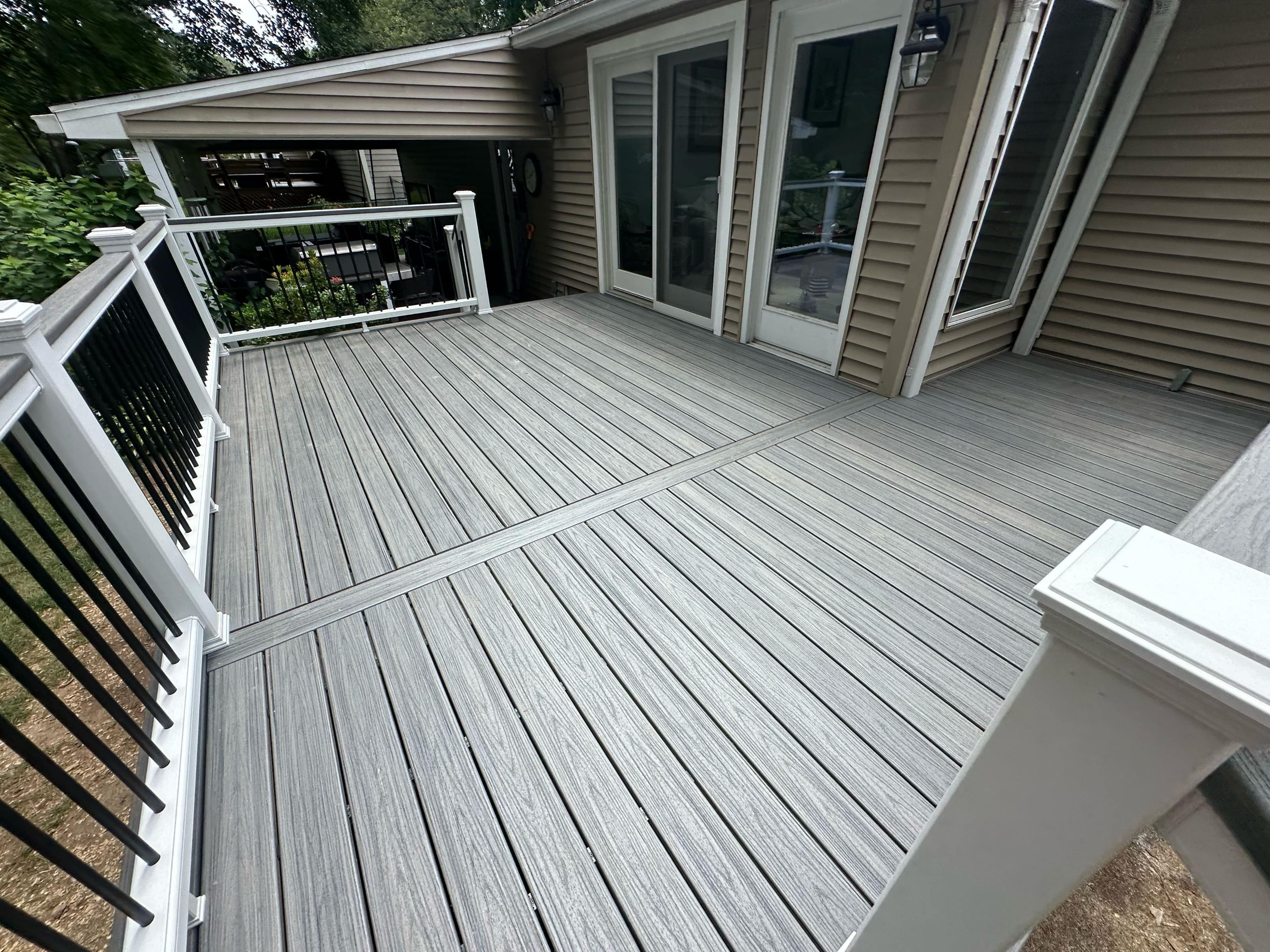 Deck Replacement with Trex Tropical Island Mist , matching cocktail rail and lattice bottom by DiGiorgi Roofing and Siding Inc