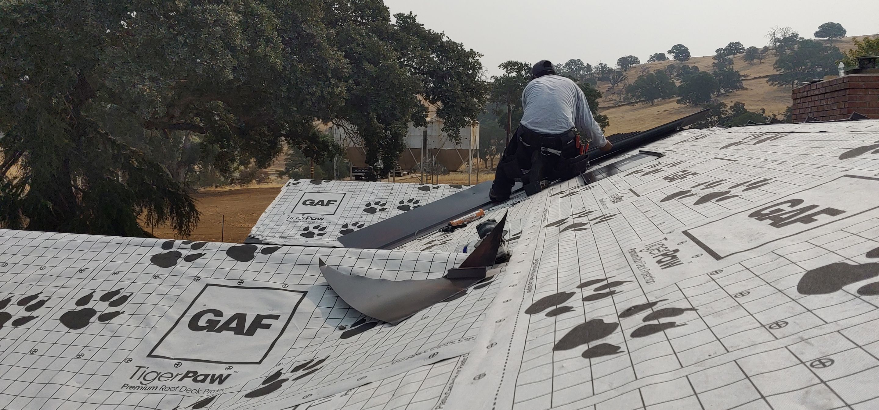 Residential Roofing Installation using Standing seam metal roofing system by Straight Edge Roofing Inc