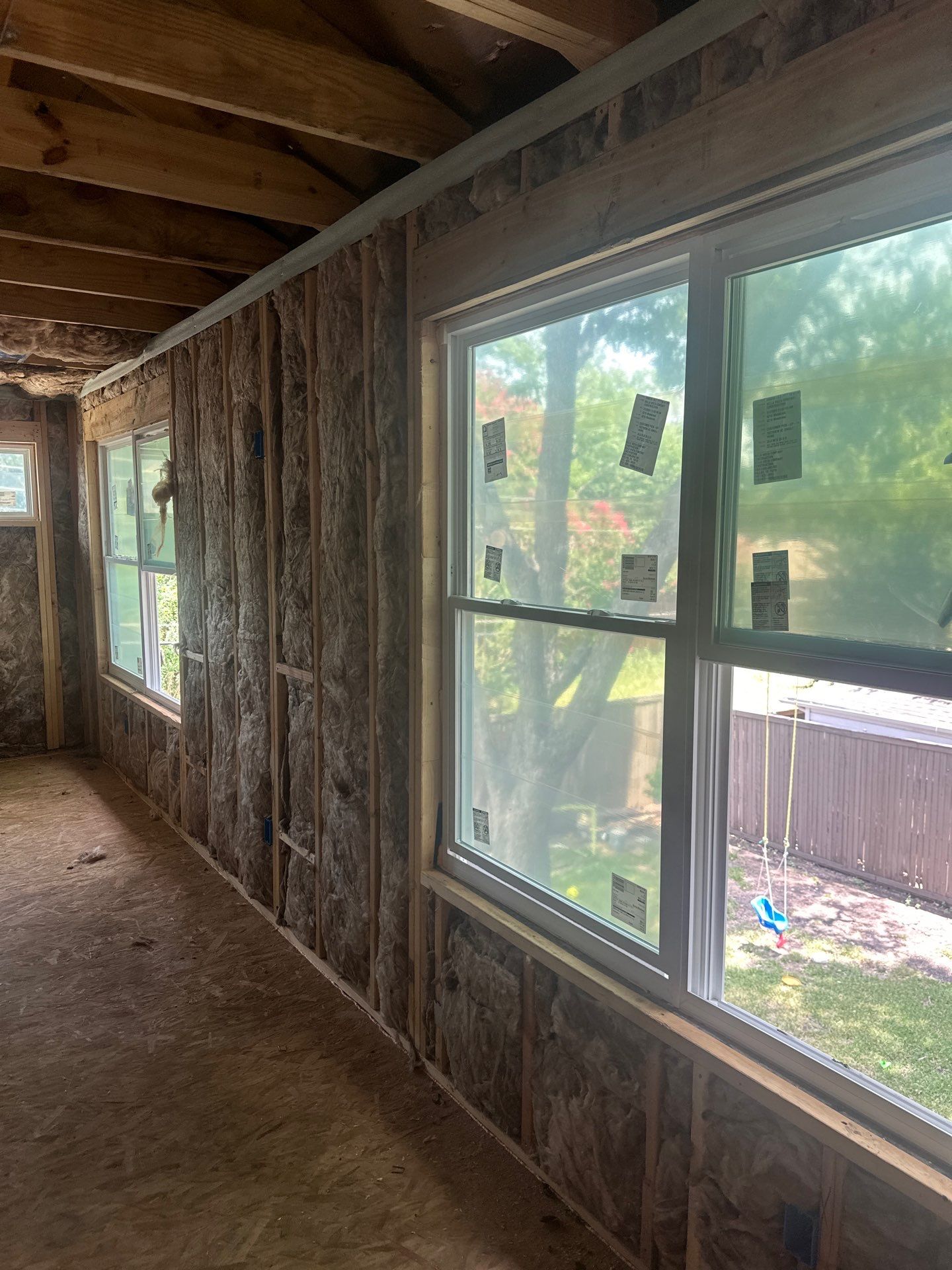 Fiberglass batt install on a second story addition in Dallas by Apex Insulation Solutions