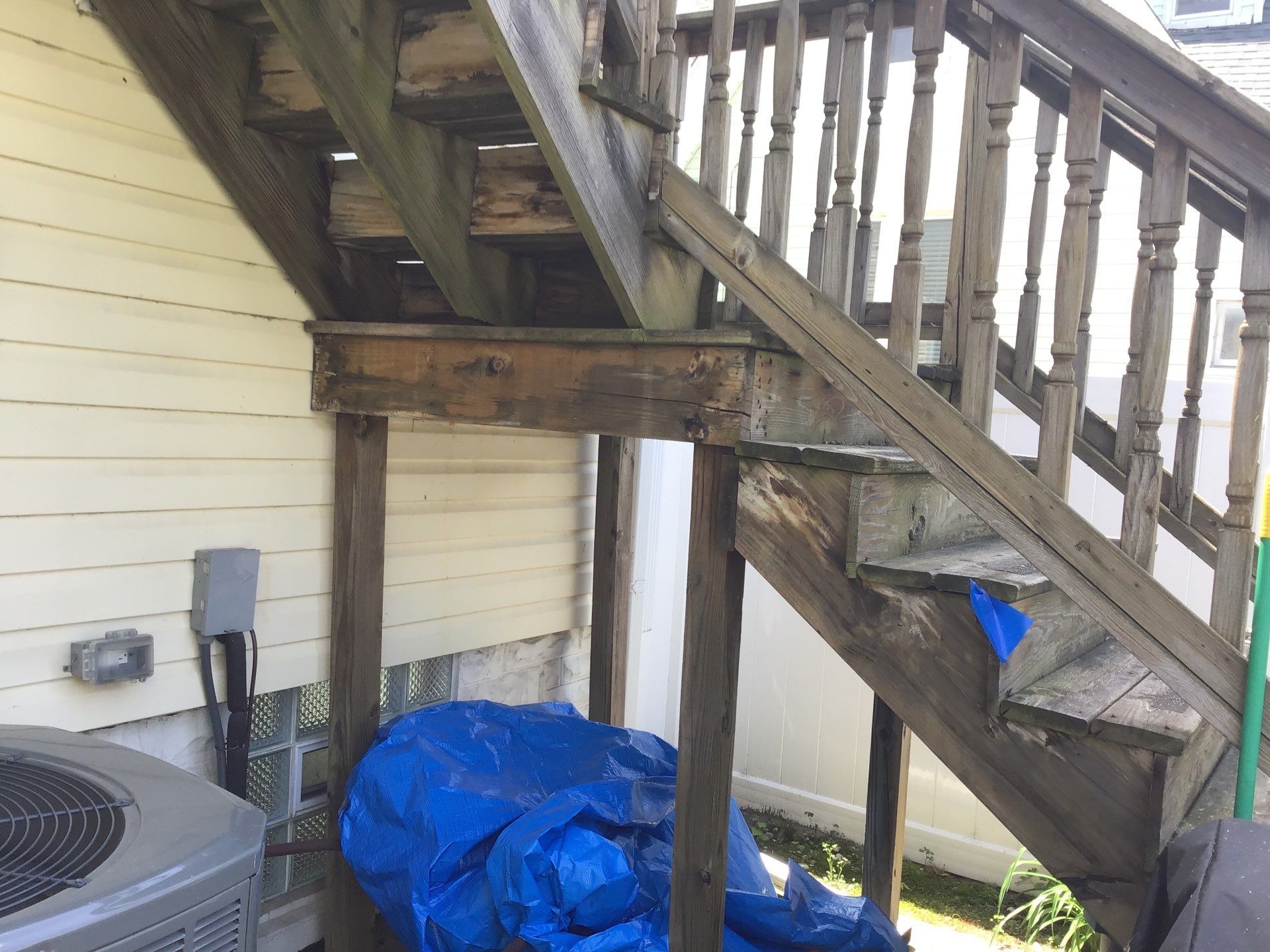 Rebuild balcony flat roofing TREX decking stairway and Railings in Wyandotte, MI by Northwest Construction 