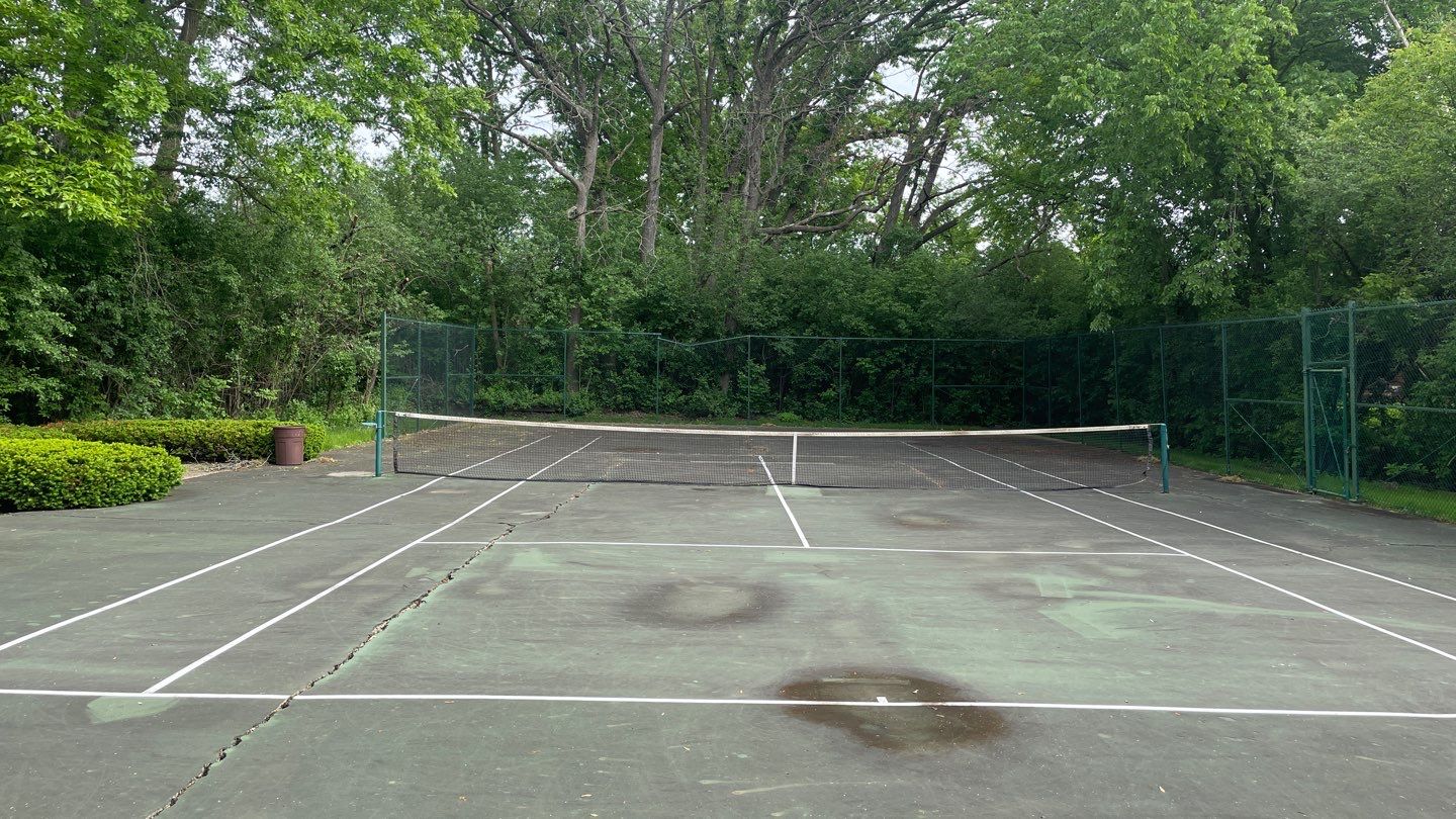 Tennis Court using Algaecide, soft wash soap by Northern Power Washing LLC.