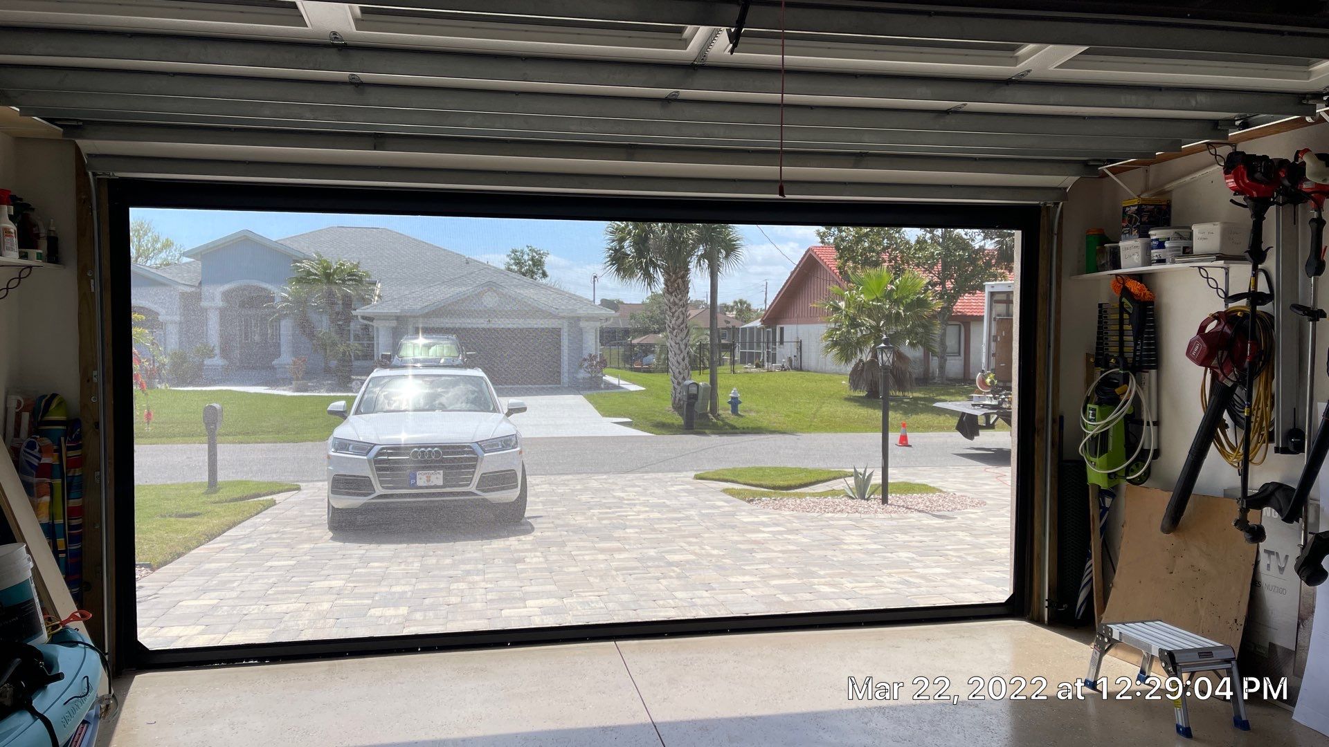 Bronze rolling screen with hurricane fabric by Smart Guard Shutters