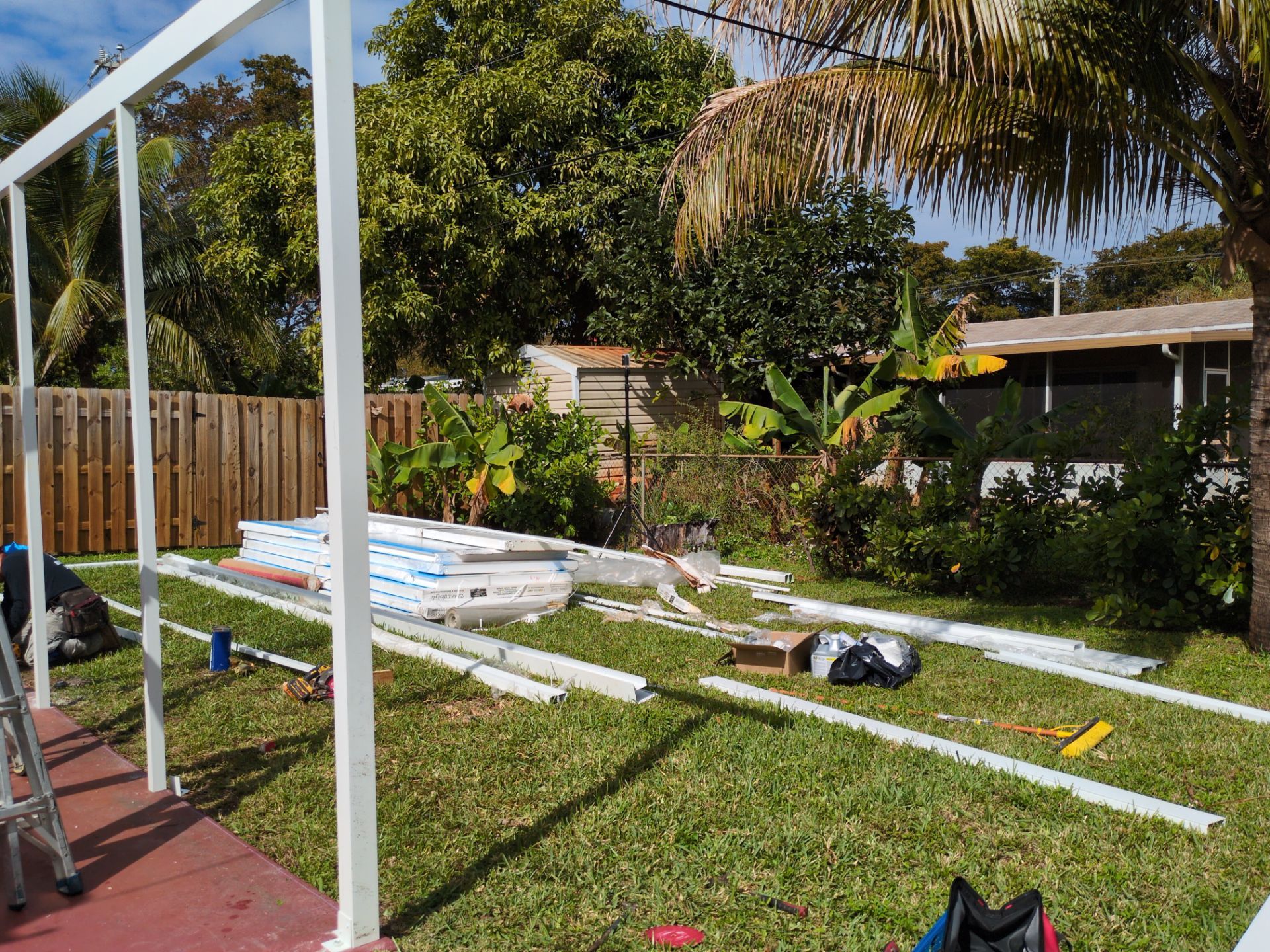 Insulated Screen Enclosure and Wood Tile Deck Installation in Plantation by Aastro Roofing