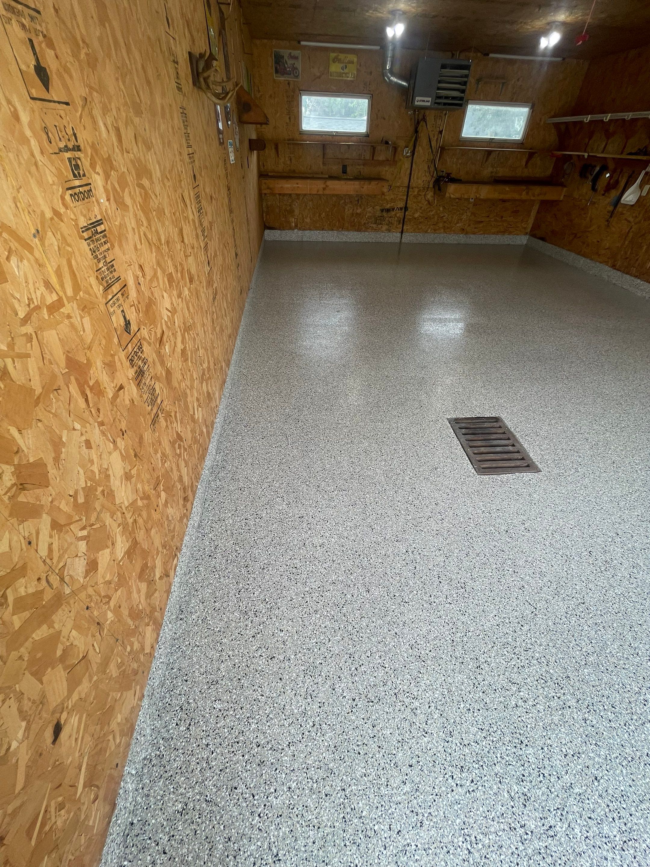 Speckled Epoxy Flake Concrete Coating for Worthington Garage Floor by Select Painting, Coatings & Garage Cabinets