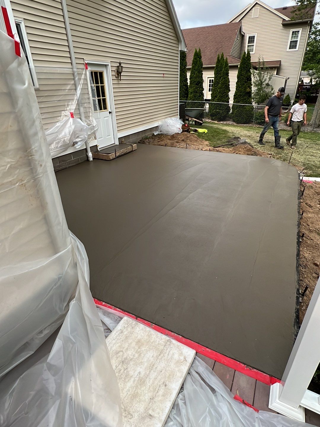 Broom finished concrete patio  by NG Masonry & Construction LLC