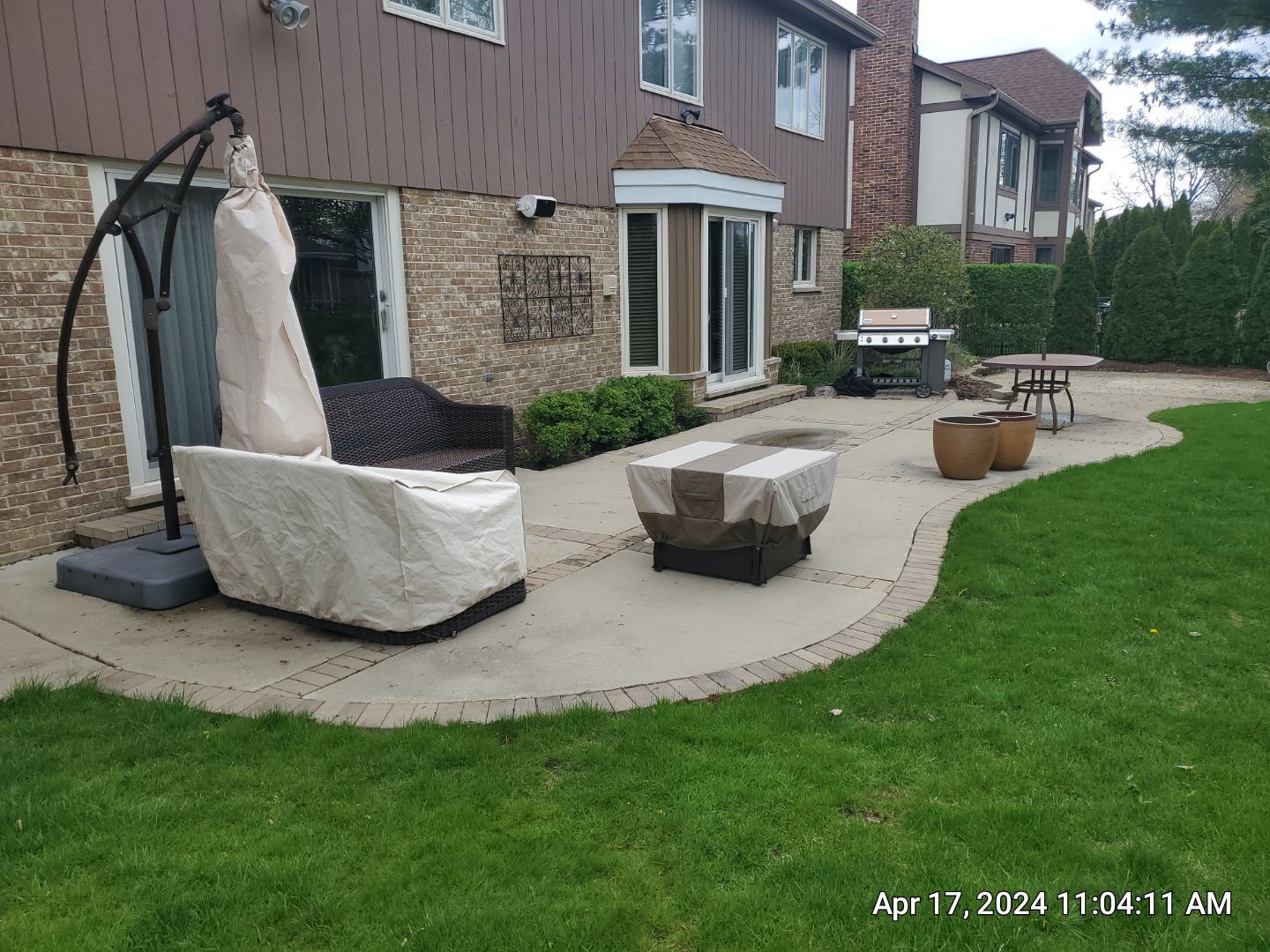 concrete patio and driveway cleaning by Northern Power Washing LLC.